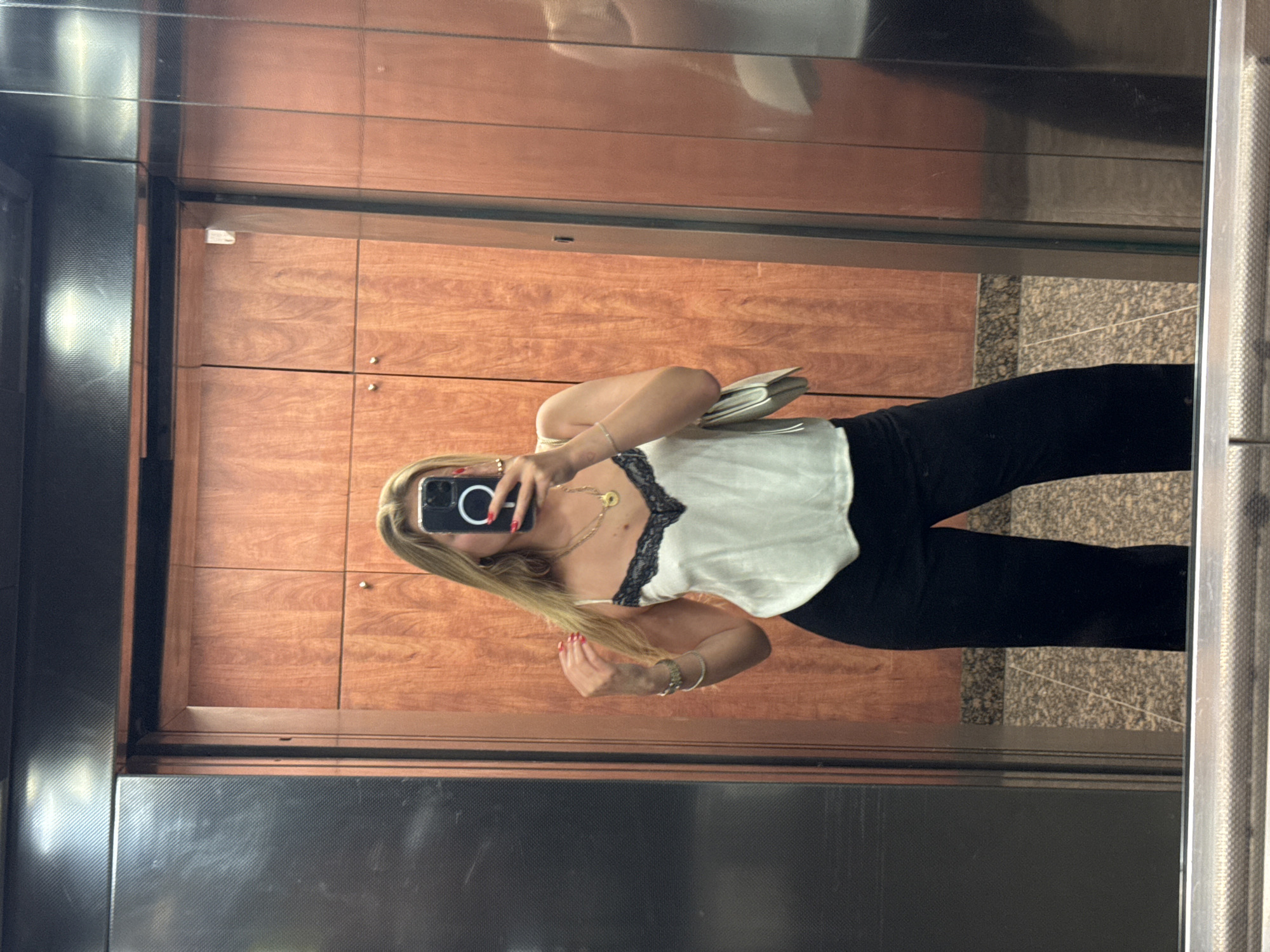 Woman takes elevator selfie in Tel Aviv