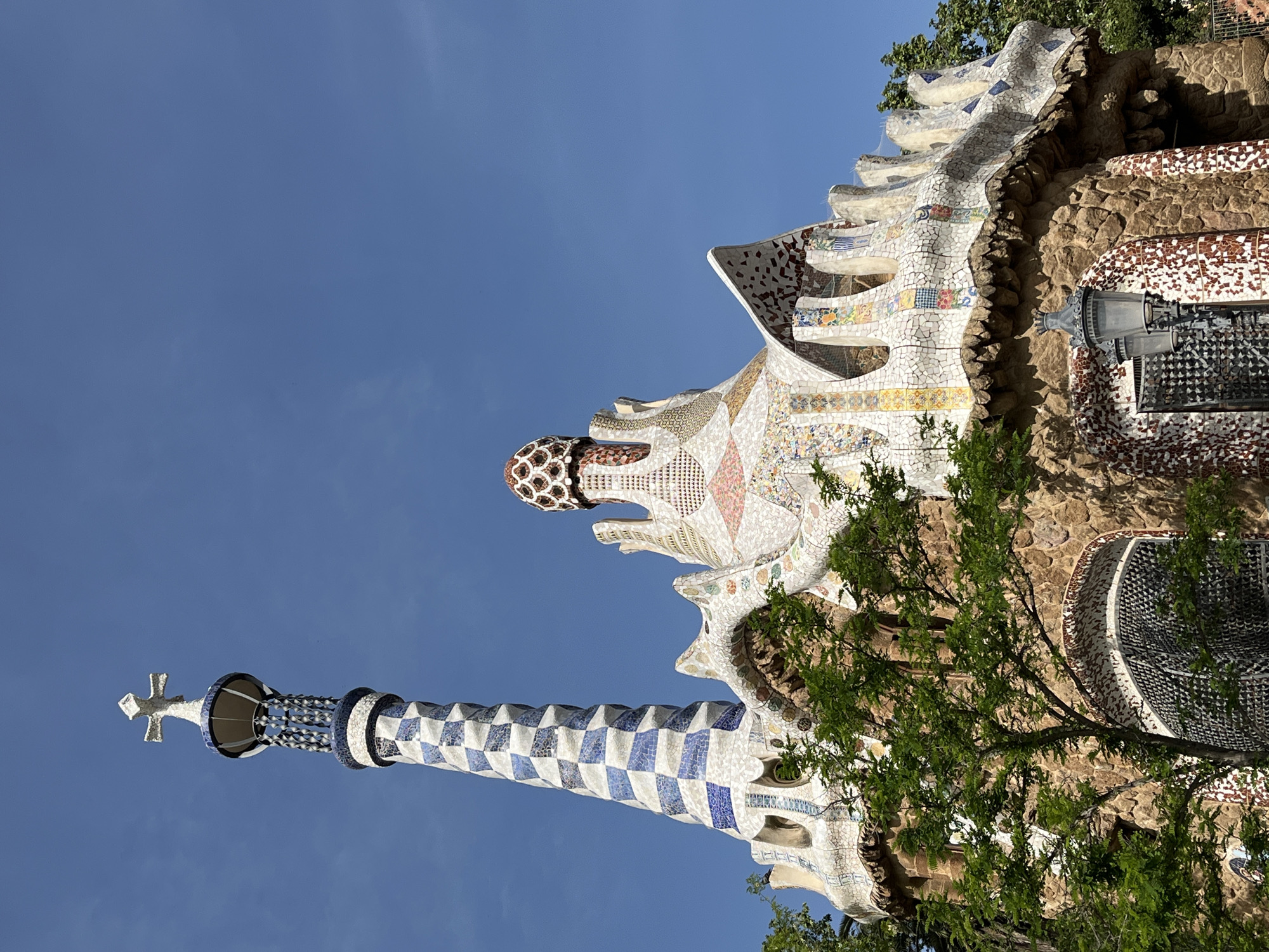Morning visitors document Park Güell's iconic architecture in Barcelona