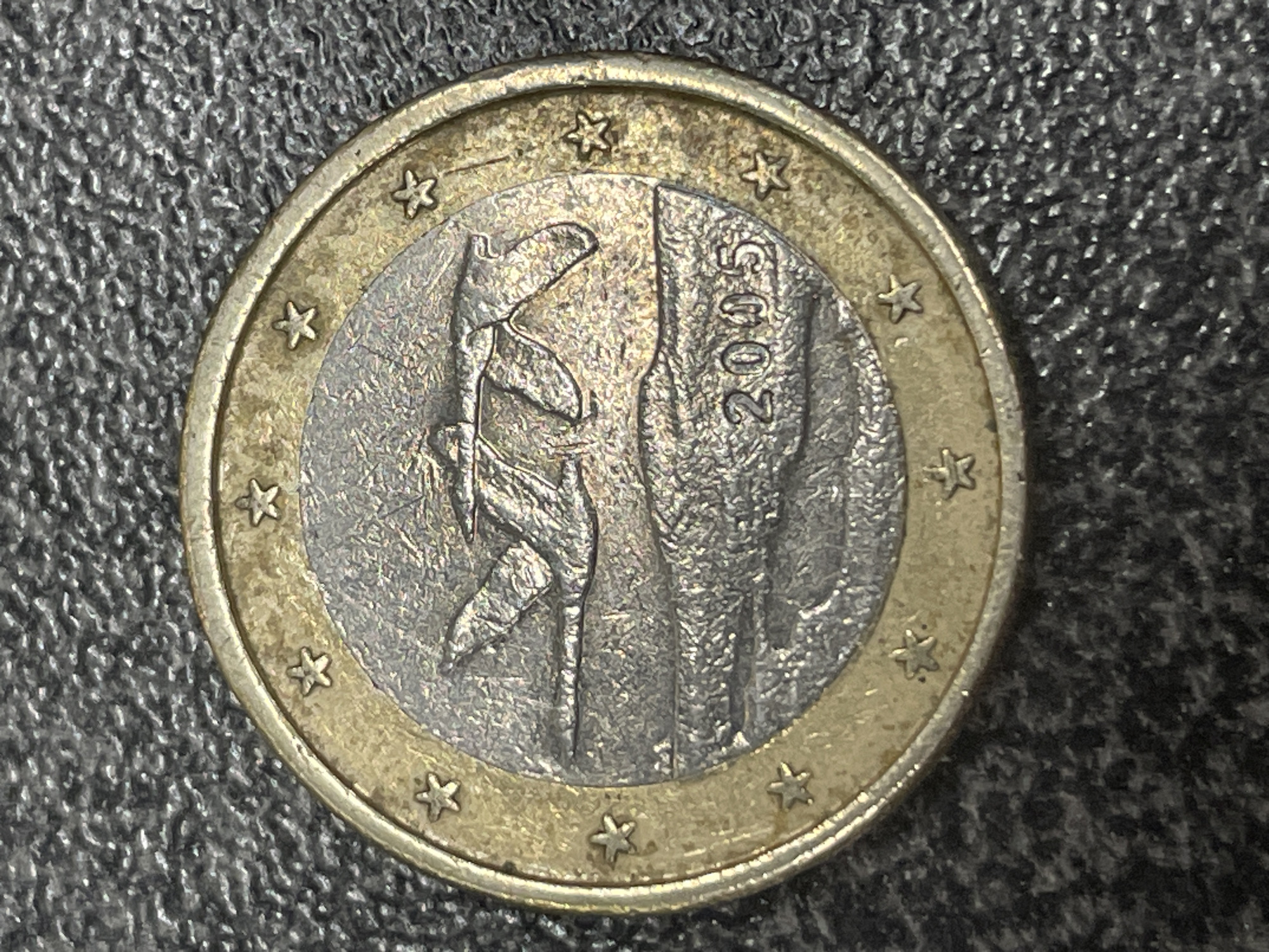 Close-up spread of assorted euro coins from multiple countries