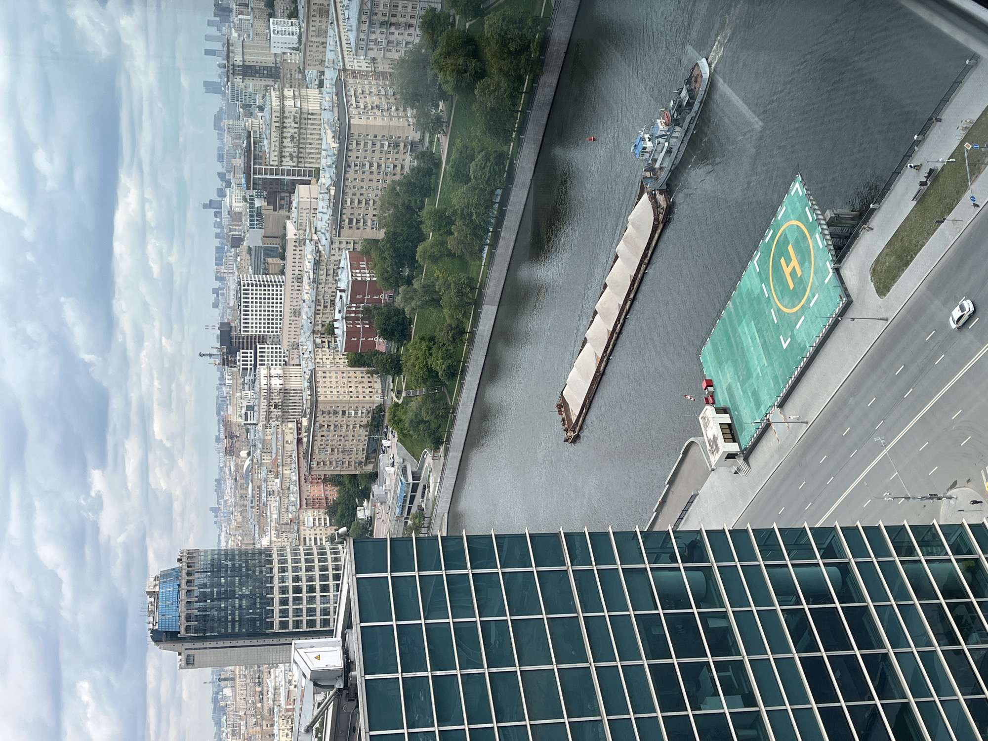 Aerial photograph captures urban riverfront from high building vantage
