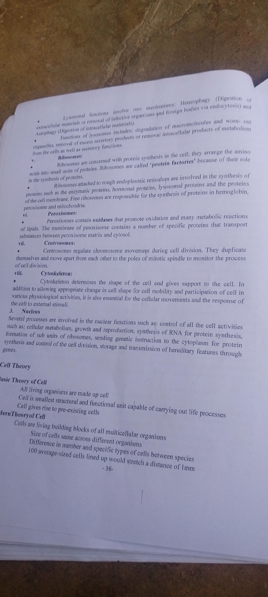 Biology textbook study session with everyday household surroundings nearby
