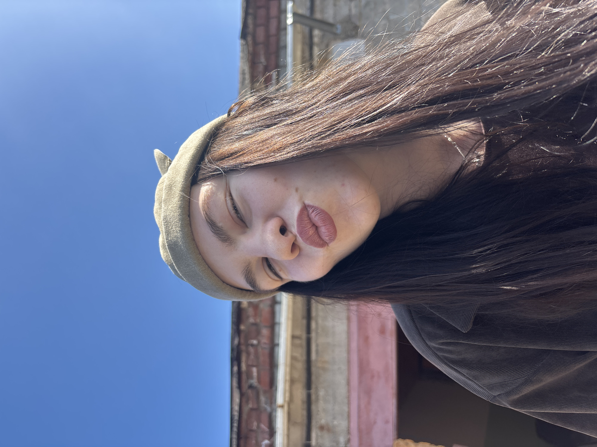 Woman poses for photos in residential Perm neighborhood