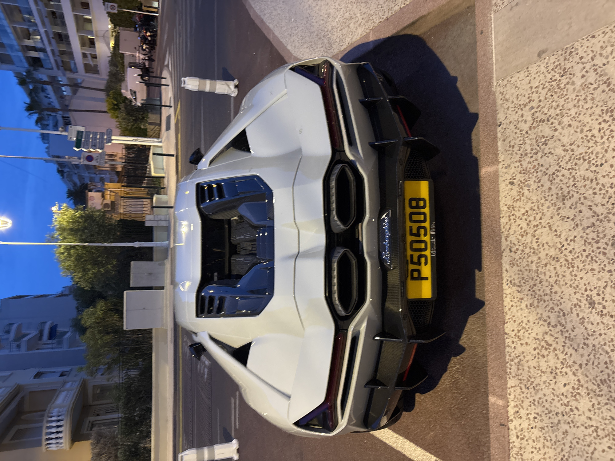 Upscale dining experience documented at Cannes restaurant with luxury car