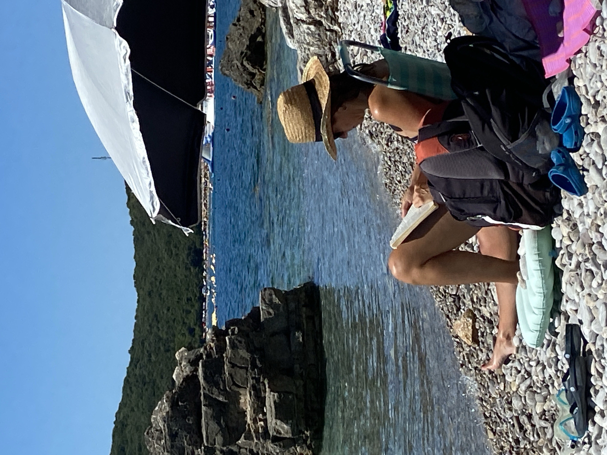 Summer day on the Montenegro coast — beach, boats, blue water