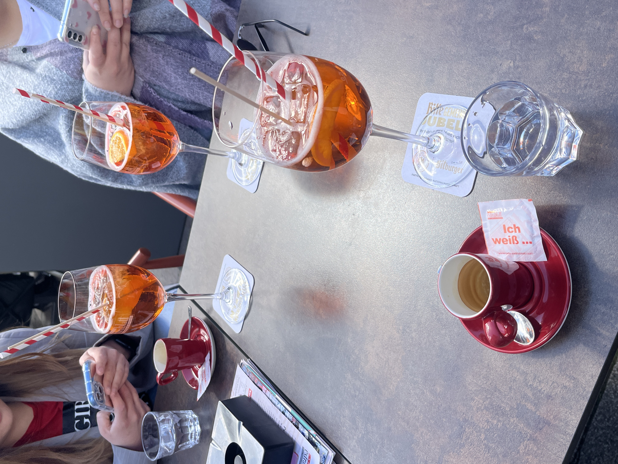 Aperol spritzes served at outdoor café in Saarbrücken