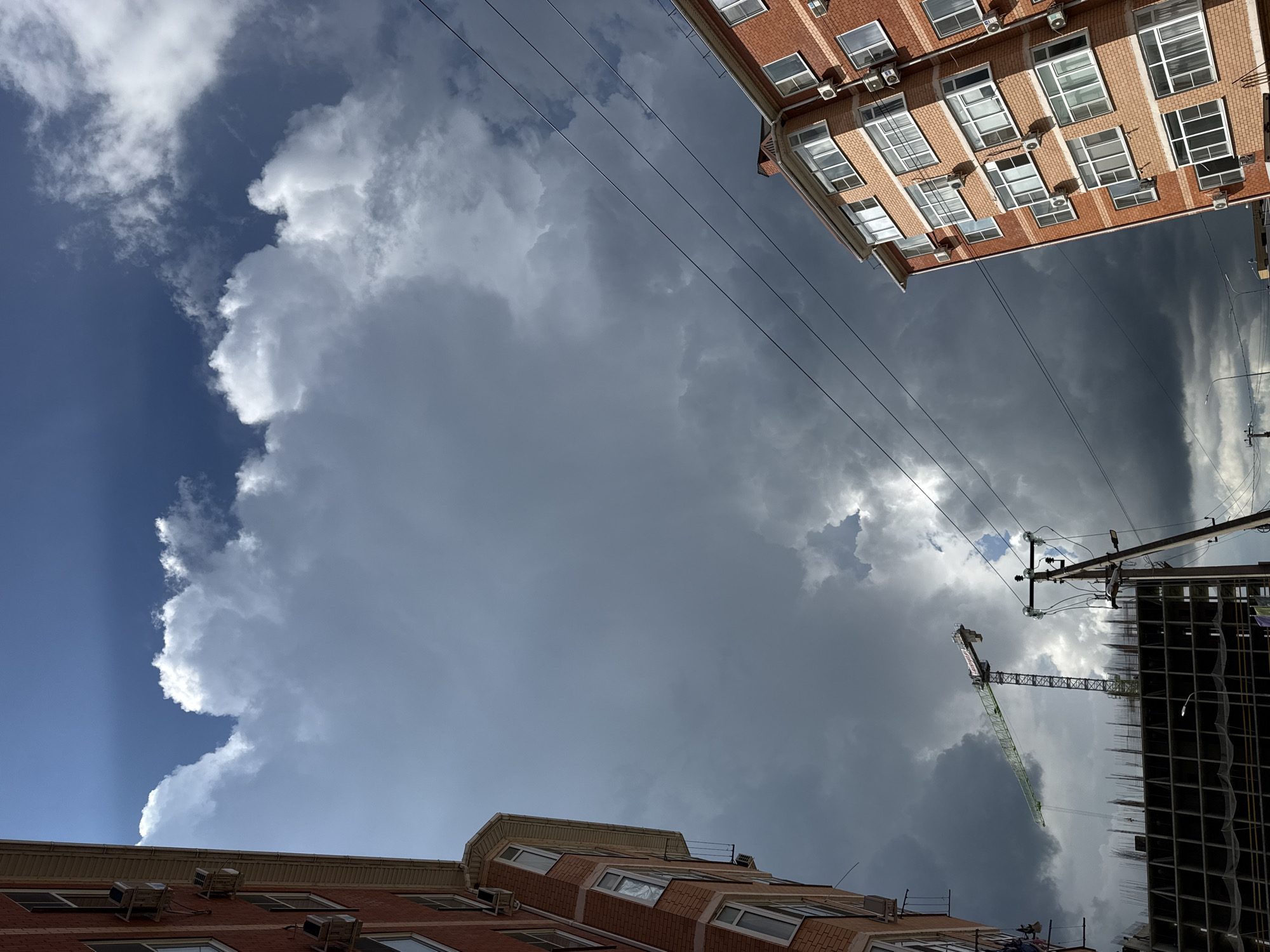 Storm clouds gather over city as witnesses document changing sky