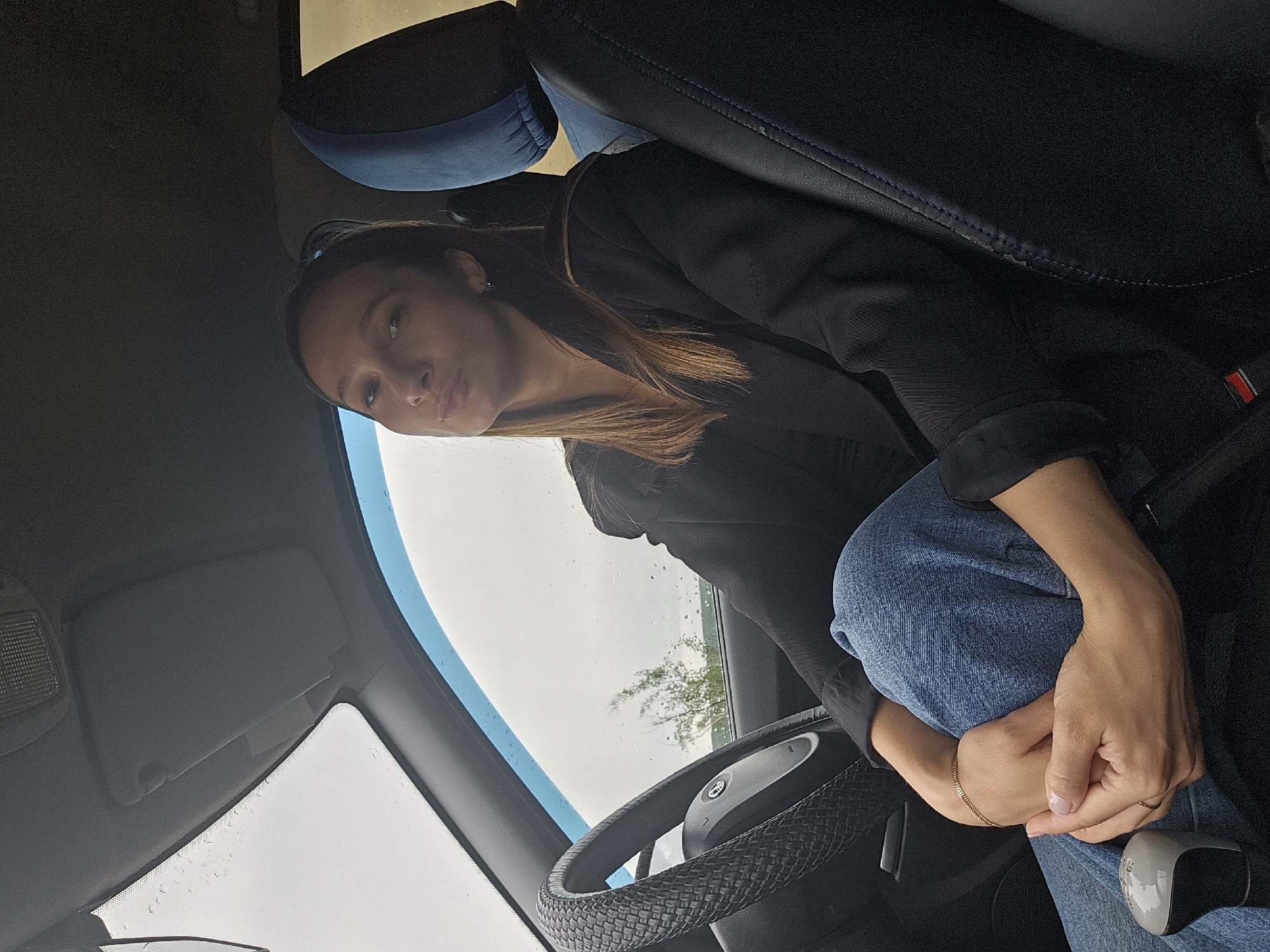 Woman photographed in driver's seat in Chaikovsky, Russia