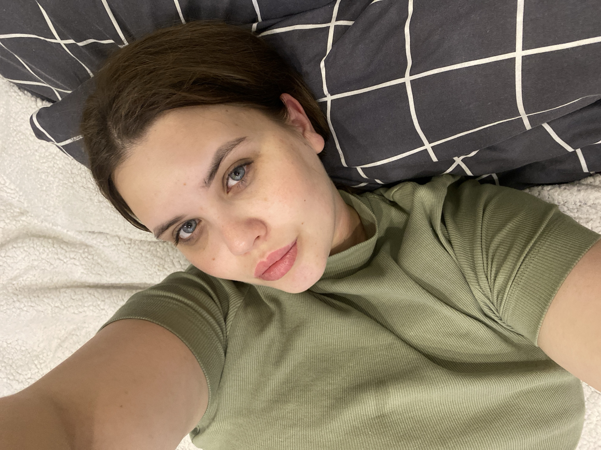 Young woman takes indoor selfie in Chernushka, Russia