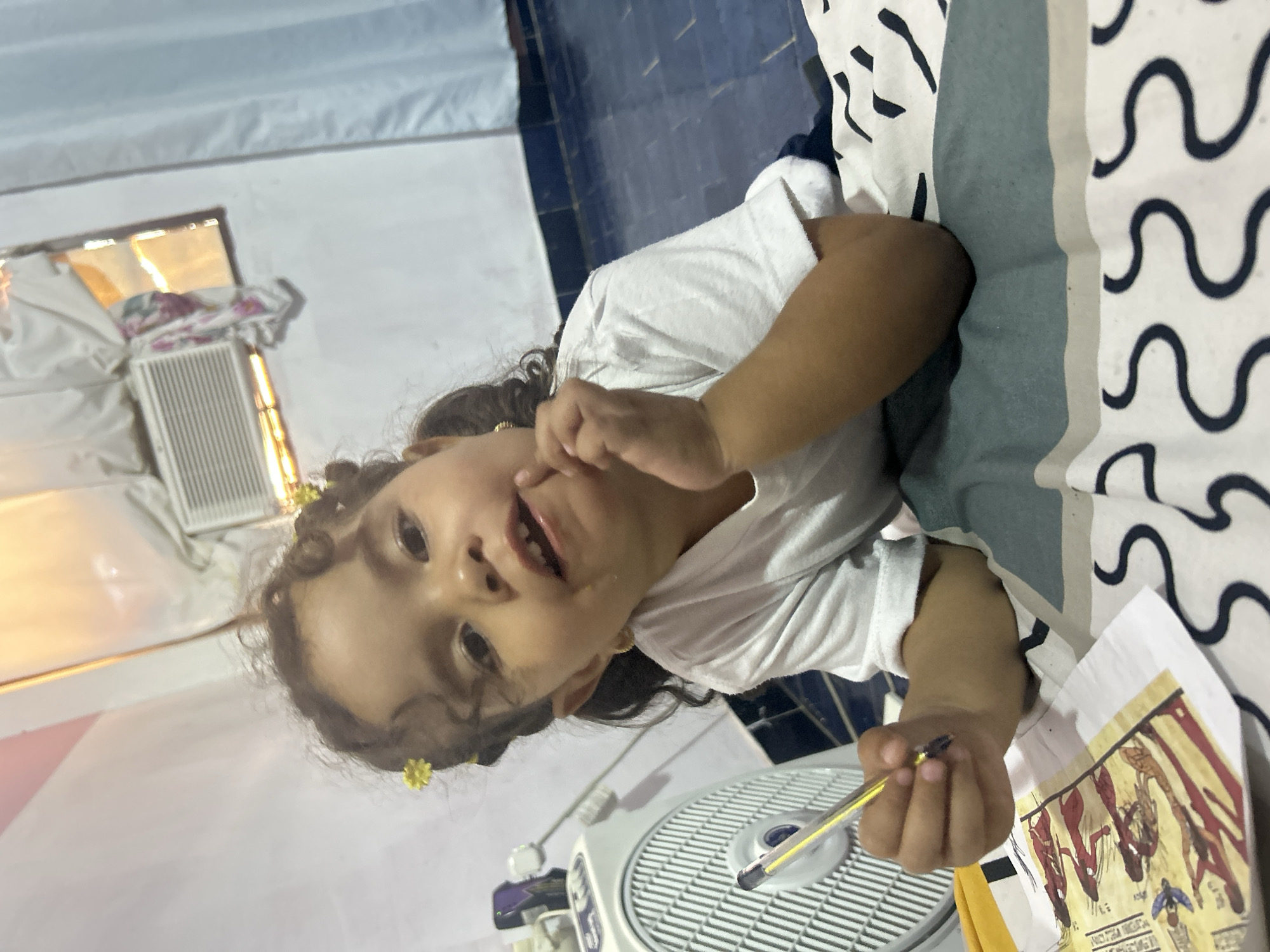 Child creates Egyptian artwork at Venezuelan preschool