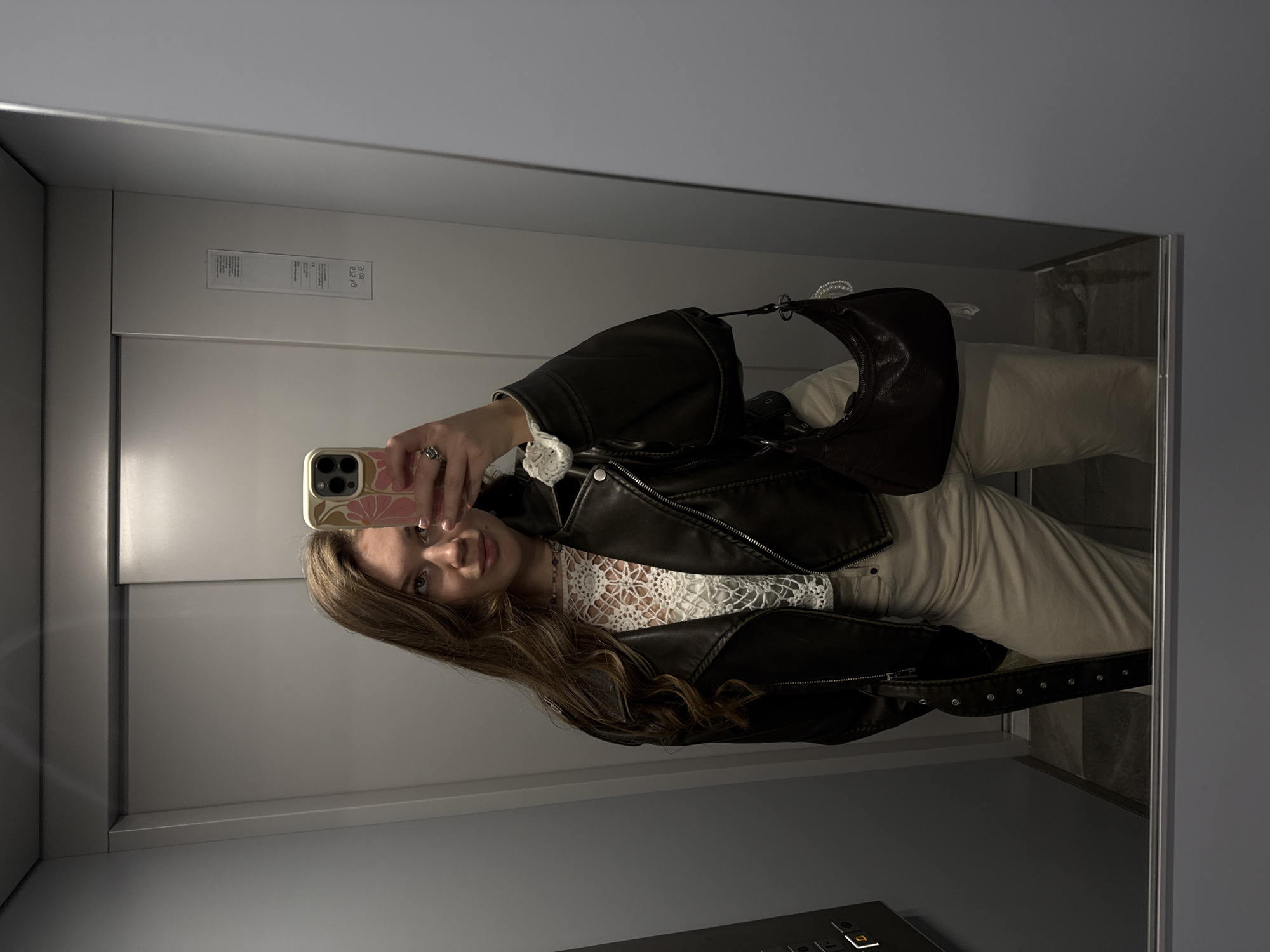 Woman Takes Mirror Selfie in Belgrade Elevator