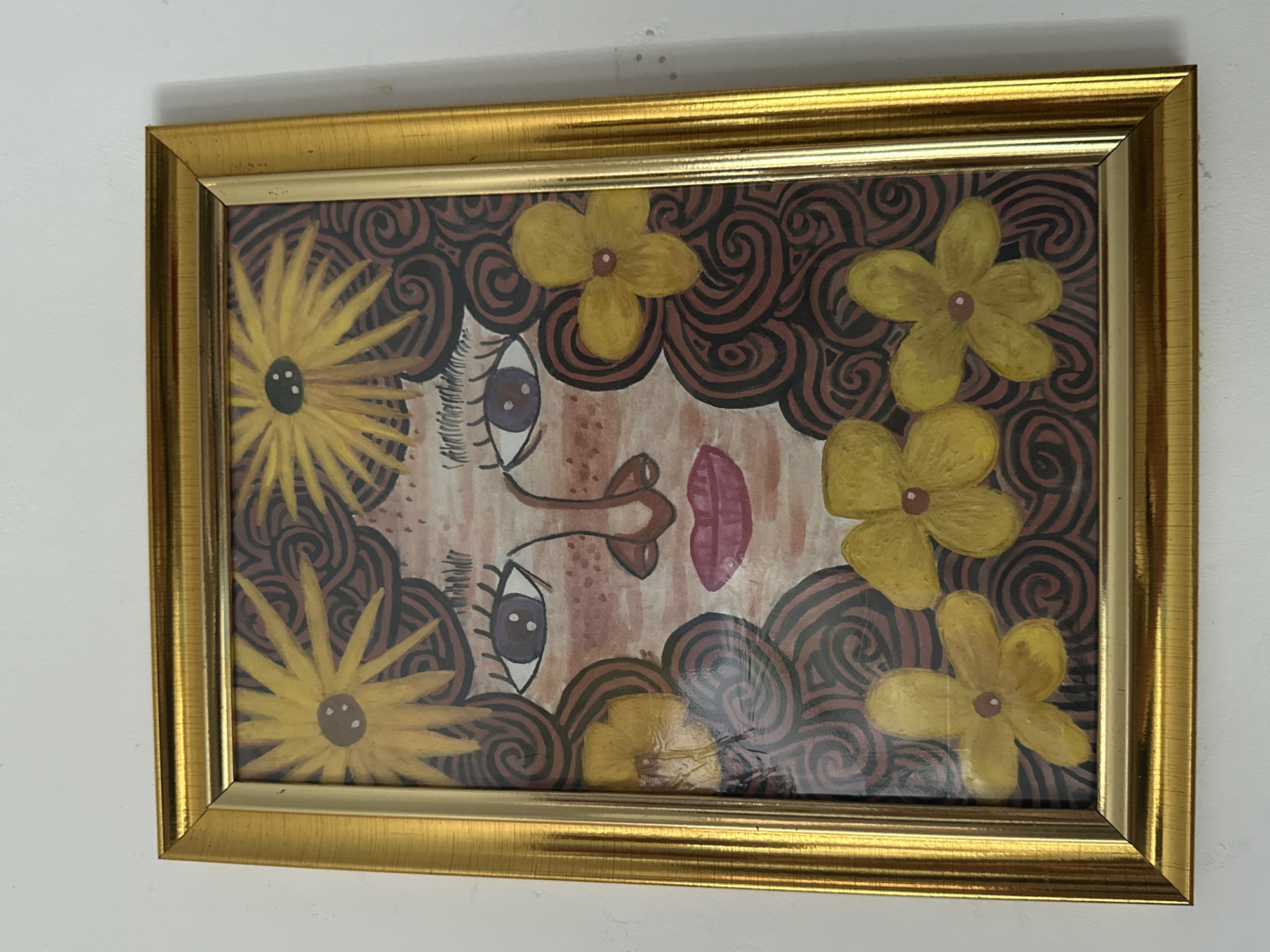 Stylized portrait paintings documented on gallery walls in Davao City