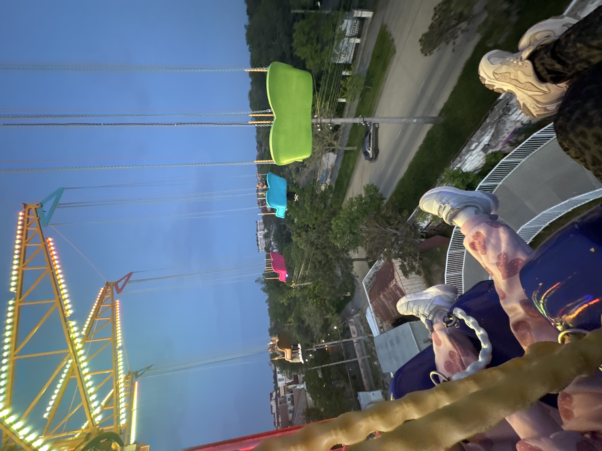 Nighttime swing ride view captured at Ukrainian amusement park