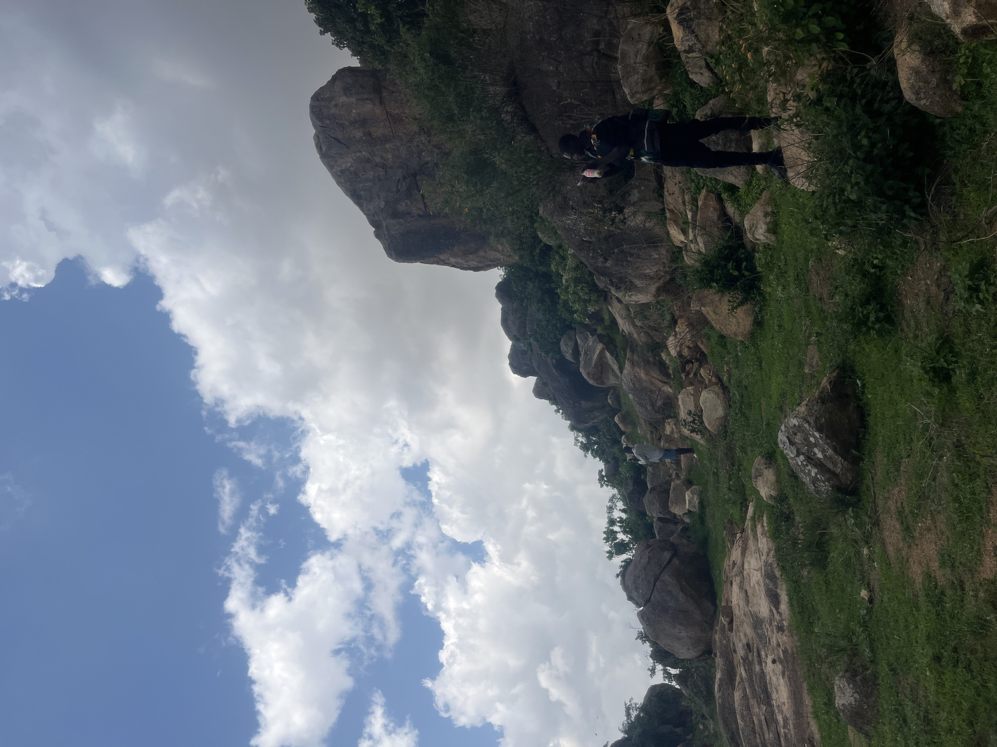 Daily life documented in rural Nigerian community amid rocky landscape