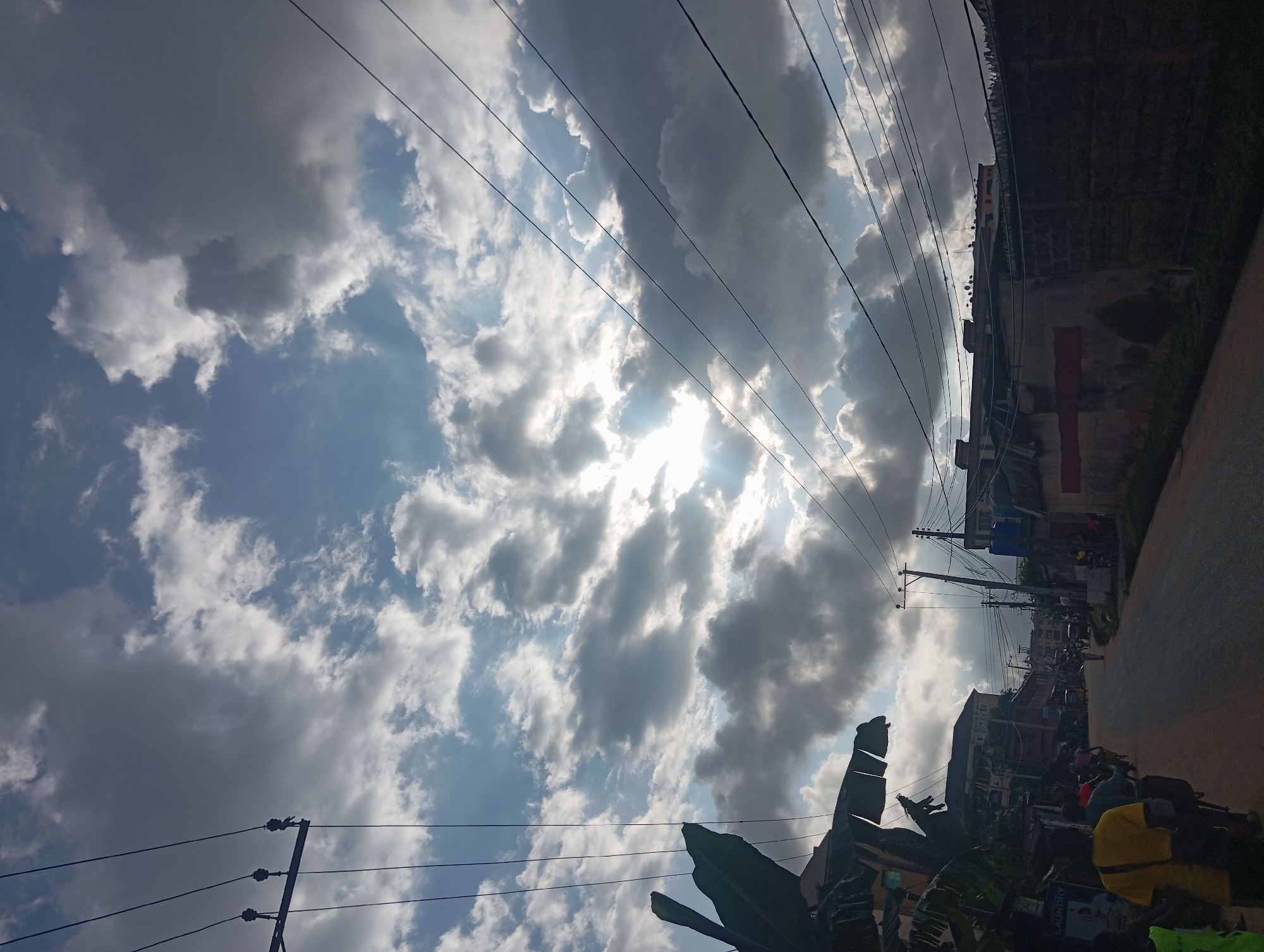 Nkpor street life under a dramatic afternoon sky