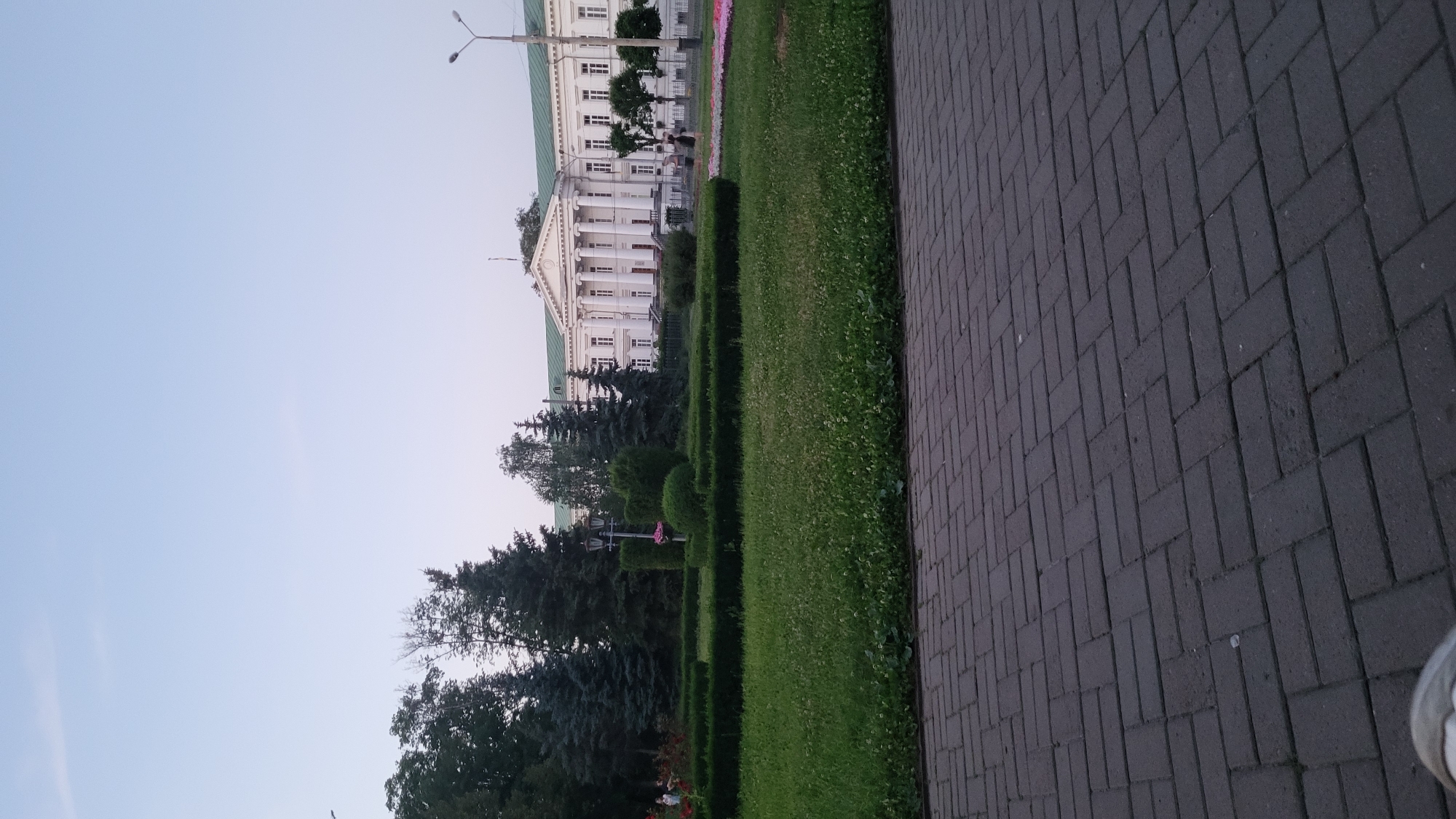 Afternoon foot traffic through a city park and plaza