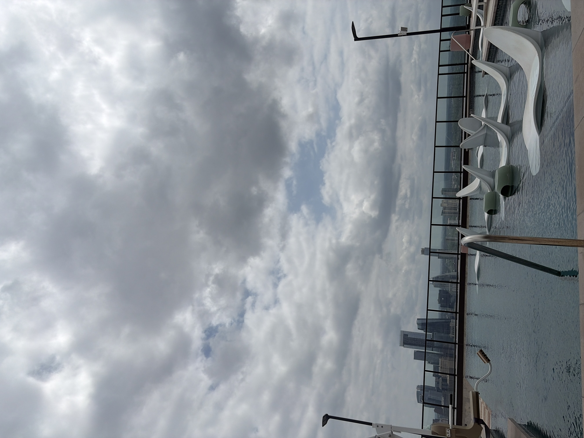 Rooftop view captures Austin skyline under dramatic evening clouds