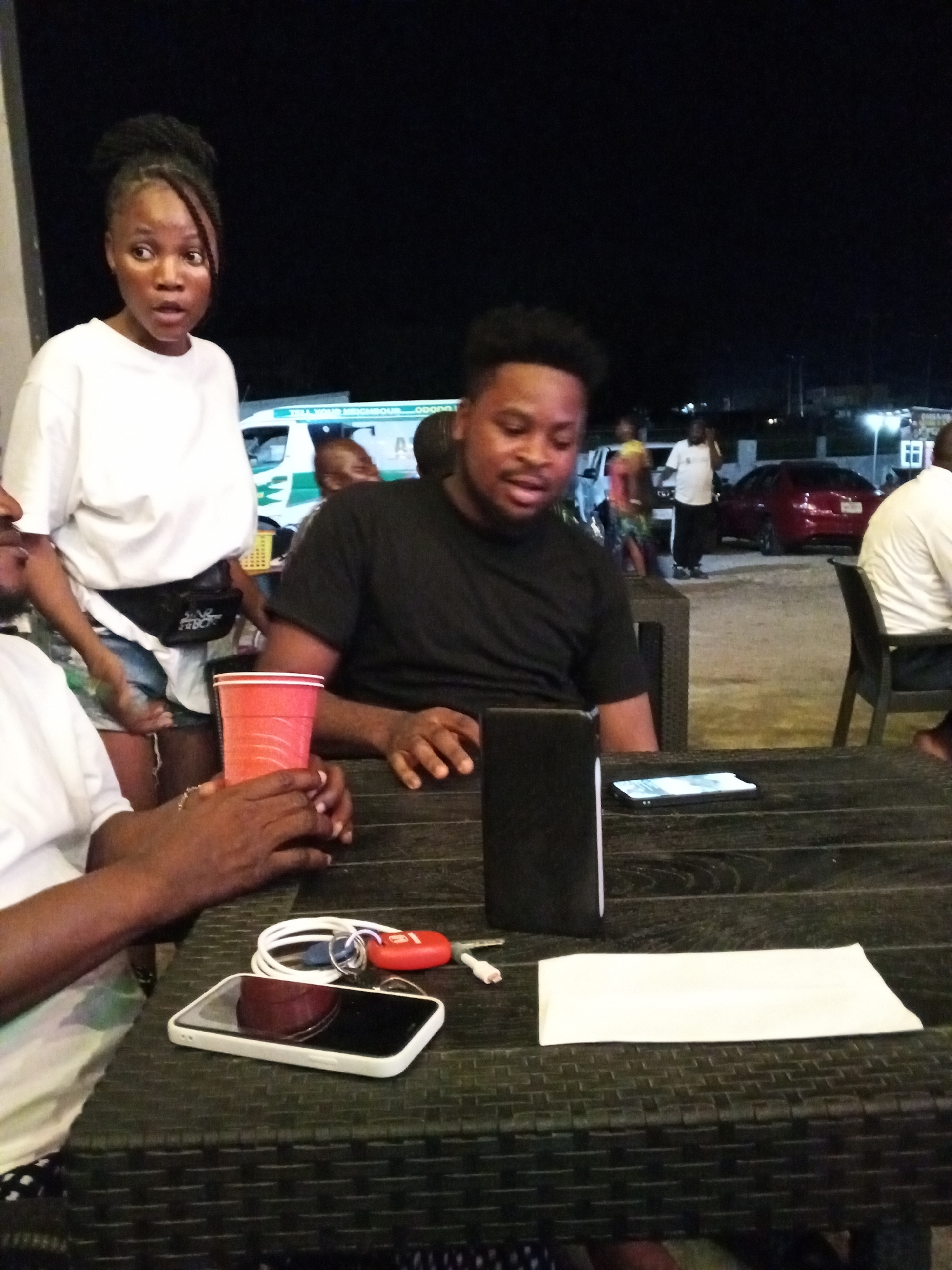 Evening social gathering documented at outdoor venue in Lokoja