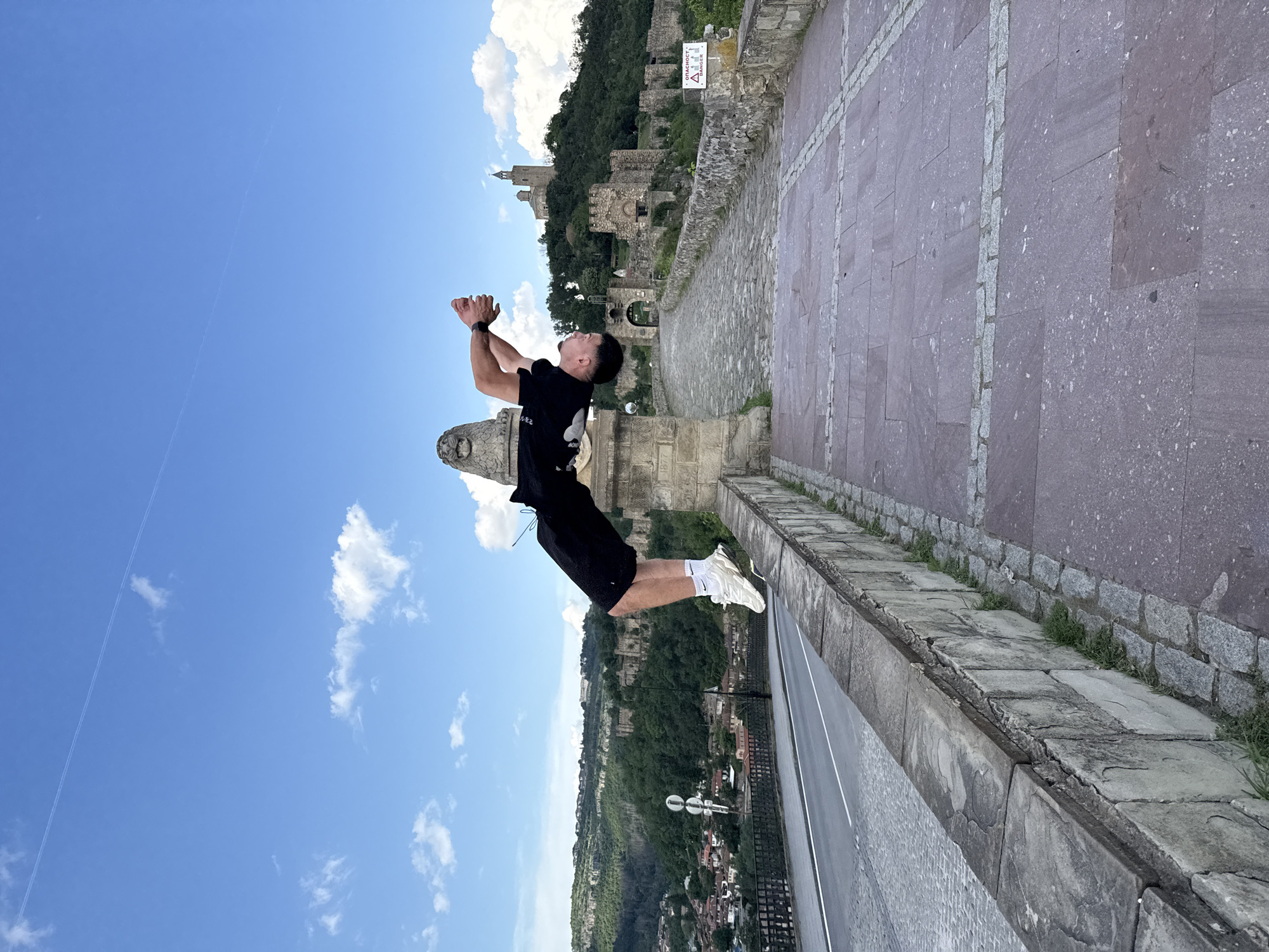 Tourist documents medieval fortress visit in Veliko Tarnovo, Bulgaria