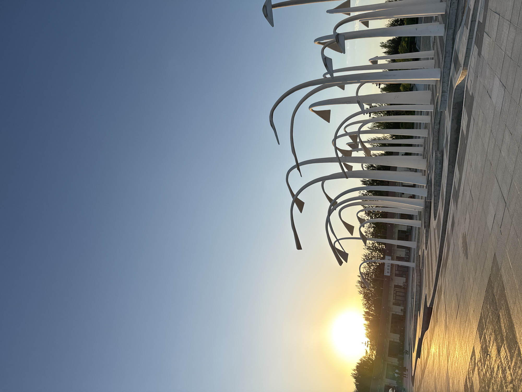 Tourist documents public art and coastal scenes in Taihe District