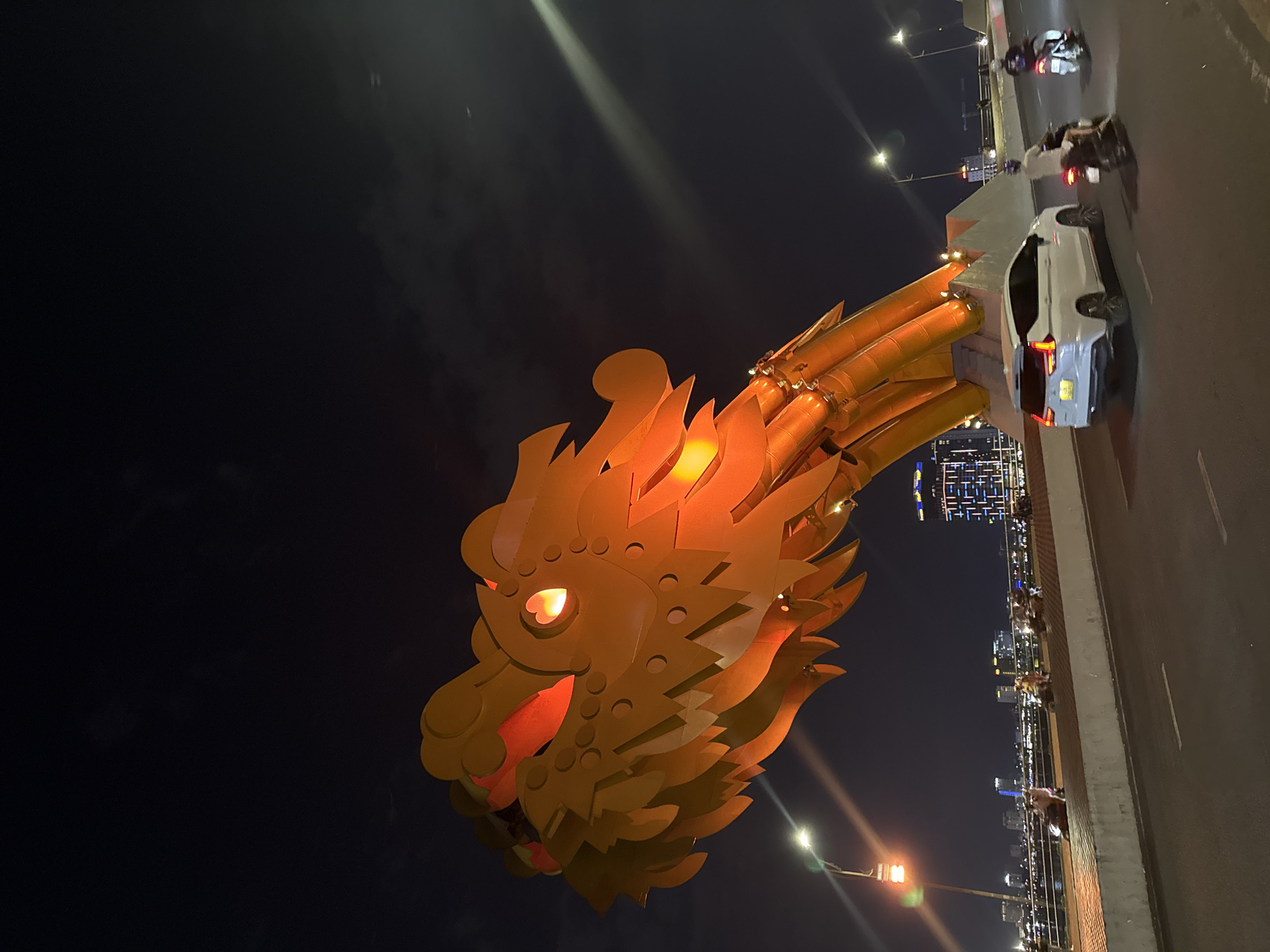Dragon Bridge glows over Da Nang's Han River at night