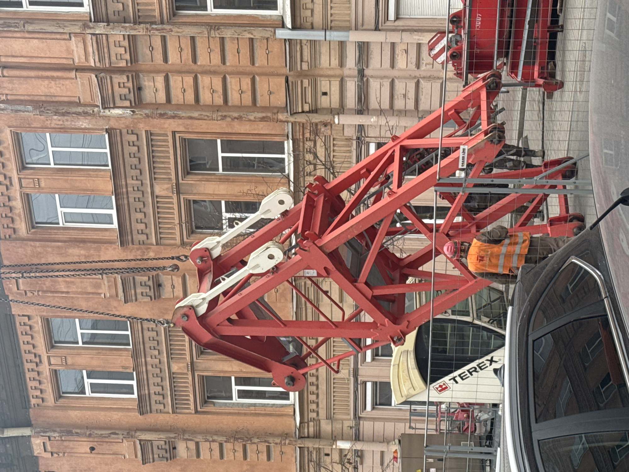 Construction crane and gothic spire documented in Saint Petersburg
