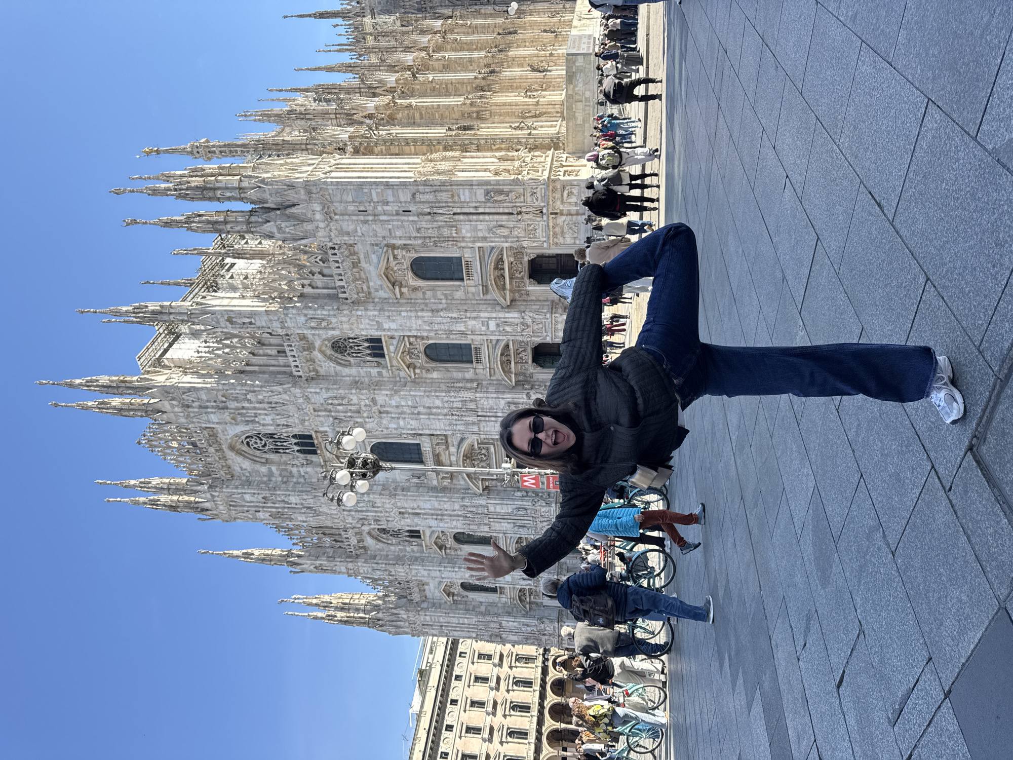 Tourists document Milan's iconic landmarks during morning sightseeing