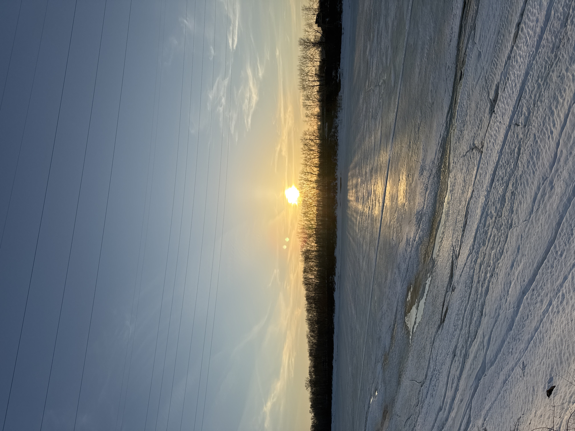 Winter sunset selfies captured along frozen river in Chaikovsky