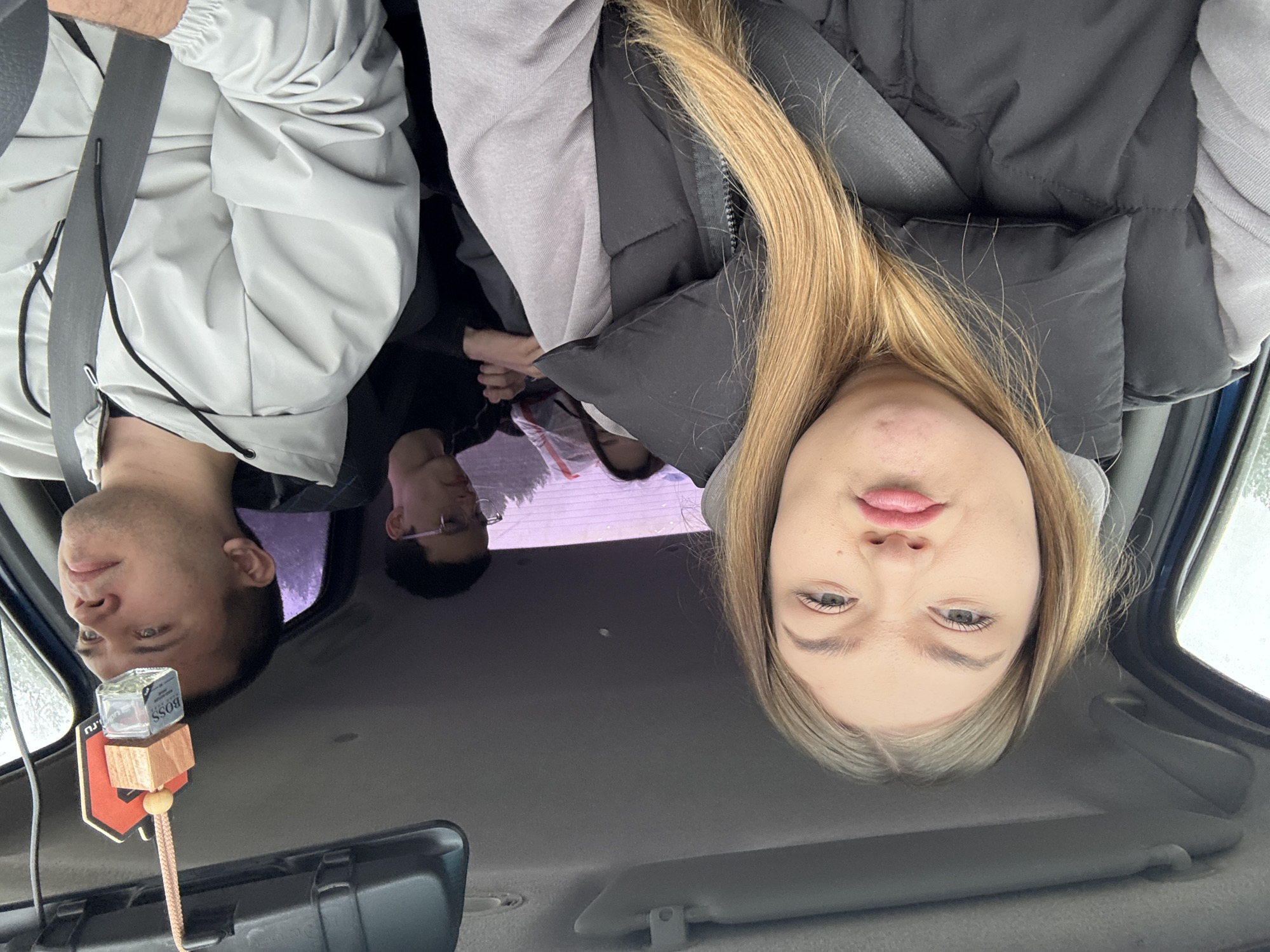 Family travels through snowy Russian countryside by vehicle