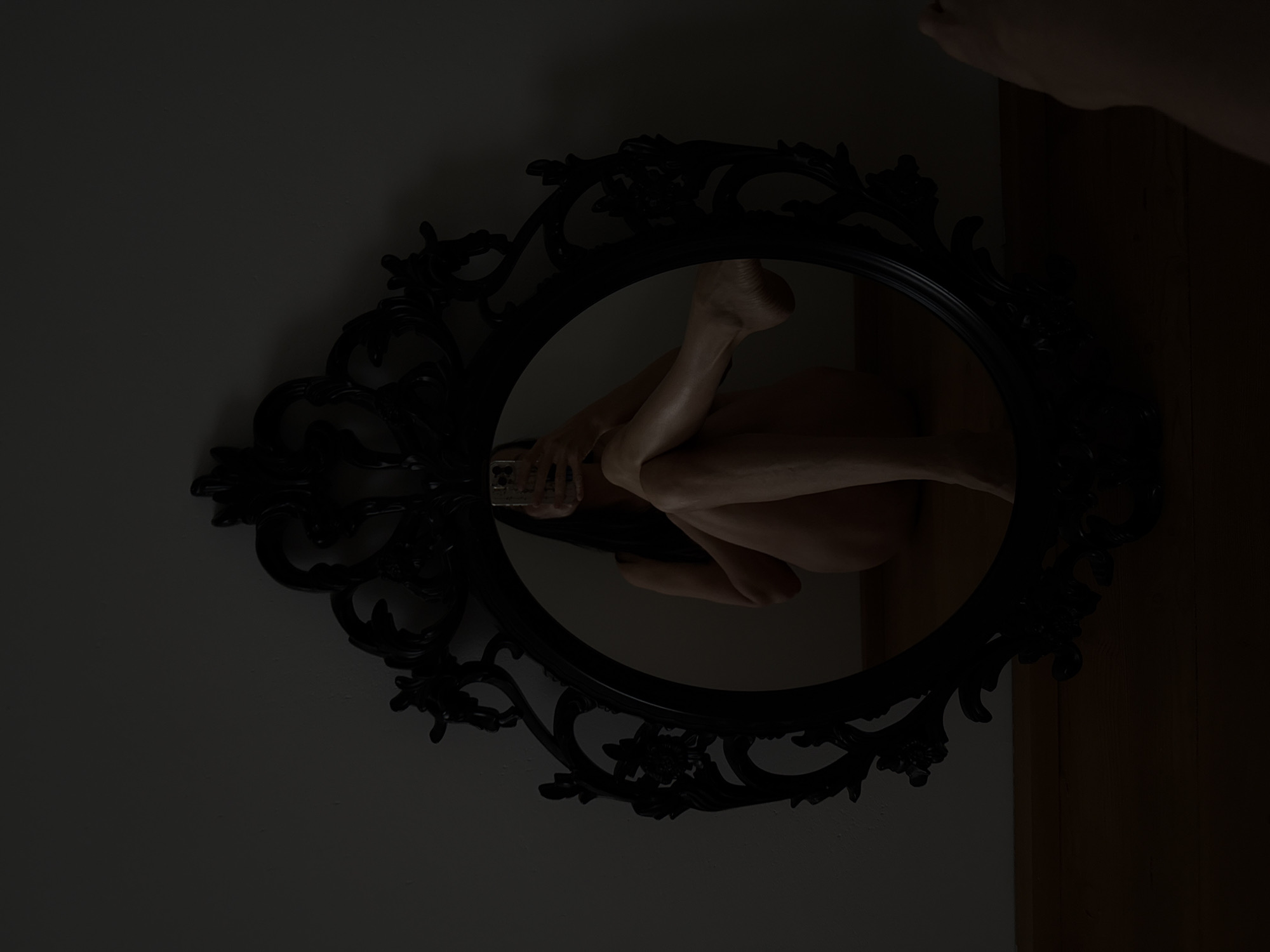 Selfie experiments with an ornate black oval mirror in Chaikovsky