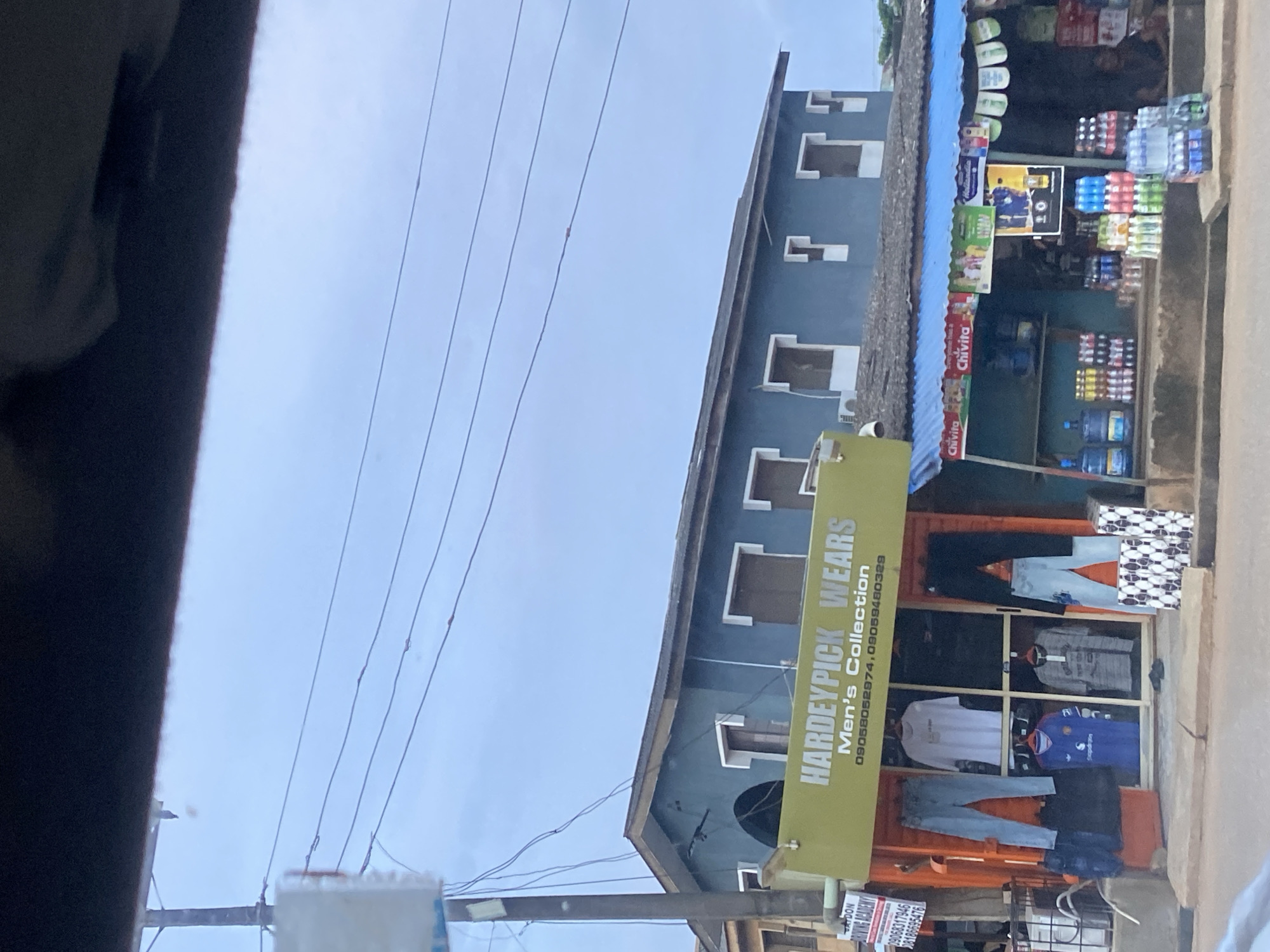 Street-level commerce and traffic in Ikorodu, Nigeria
