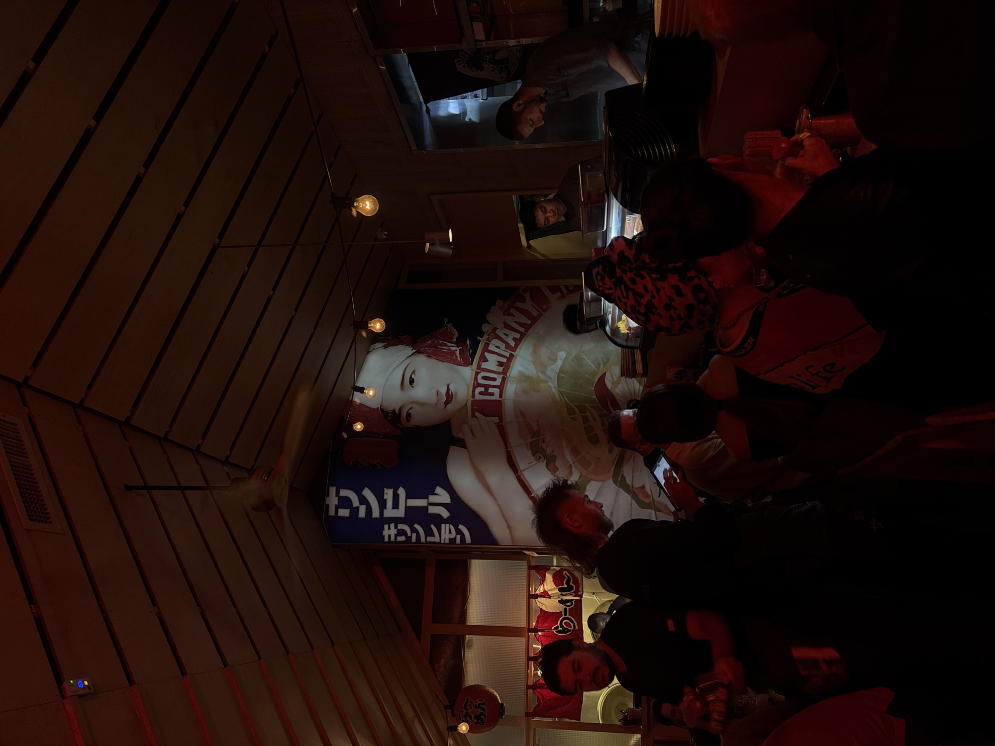 Crowded ramen restaurant captured during evening rush in Tel Aviv