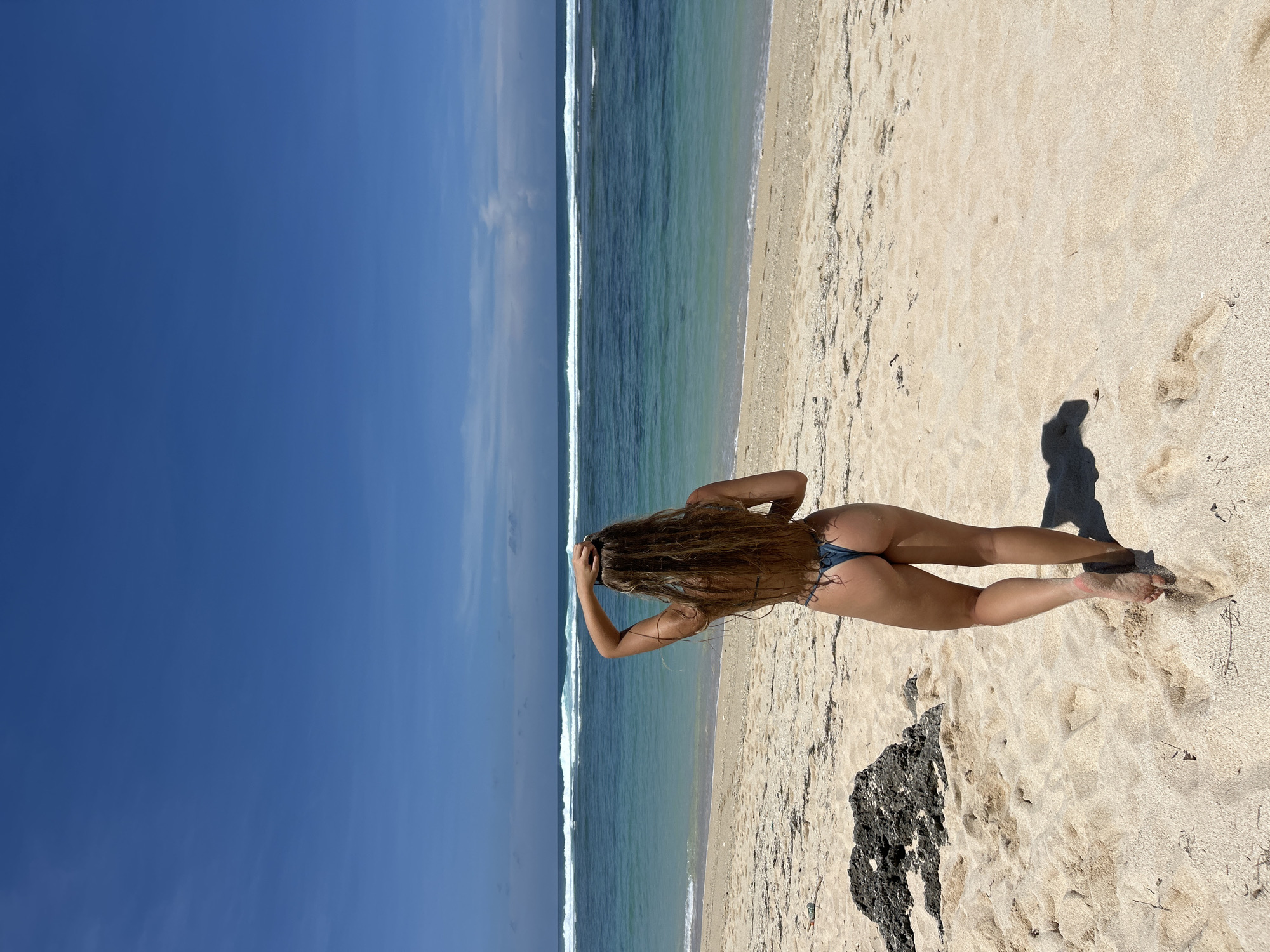 Woman in blue bikini spotted at Kuta Selatan beach
