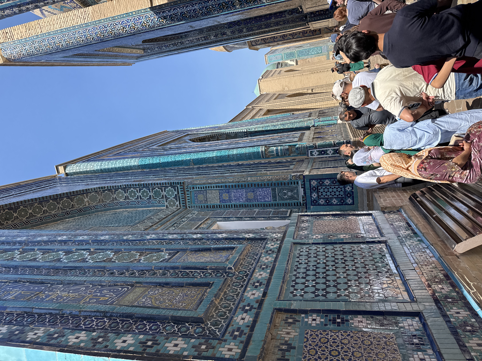 Morning tourists explore historic Samarkand necropolis and madrasah sites