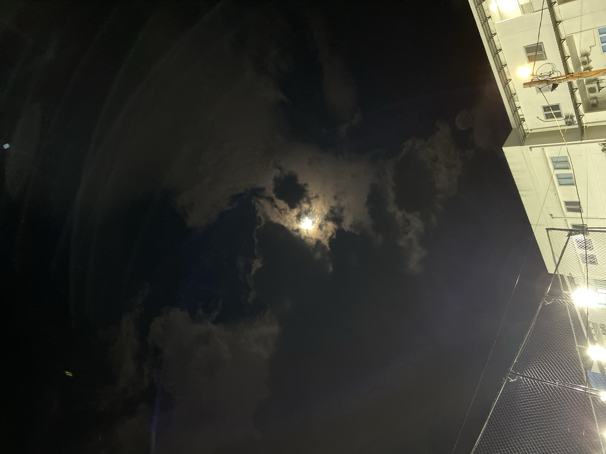 Banda Aceh neighborhood at night: courts, food spots, and new construction
