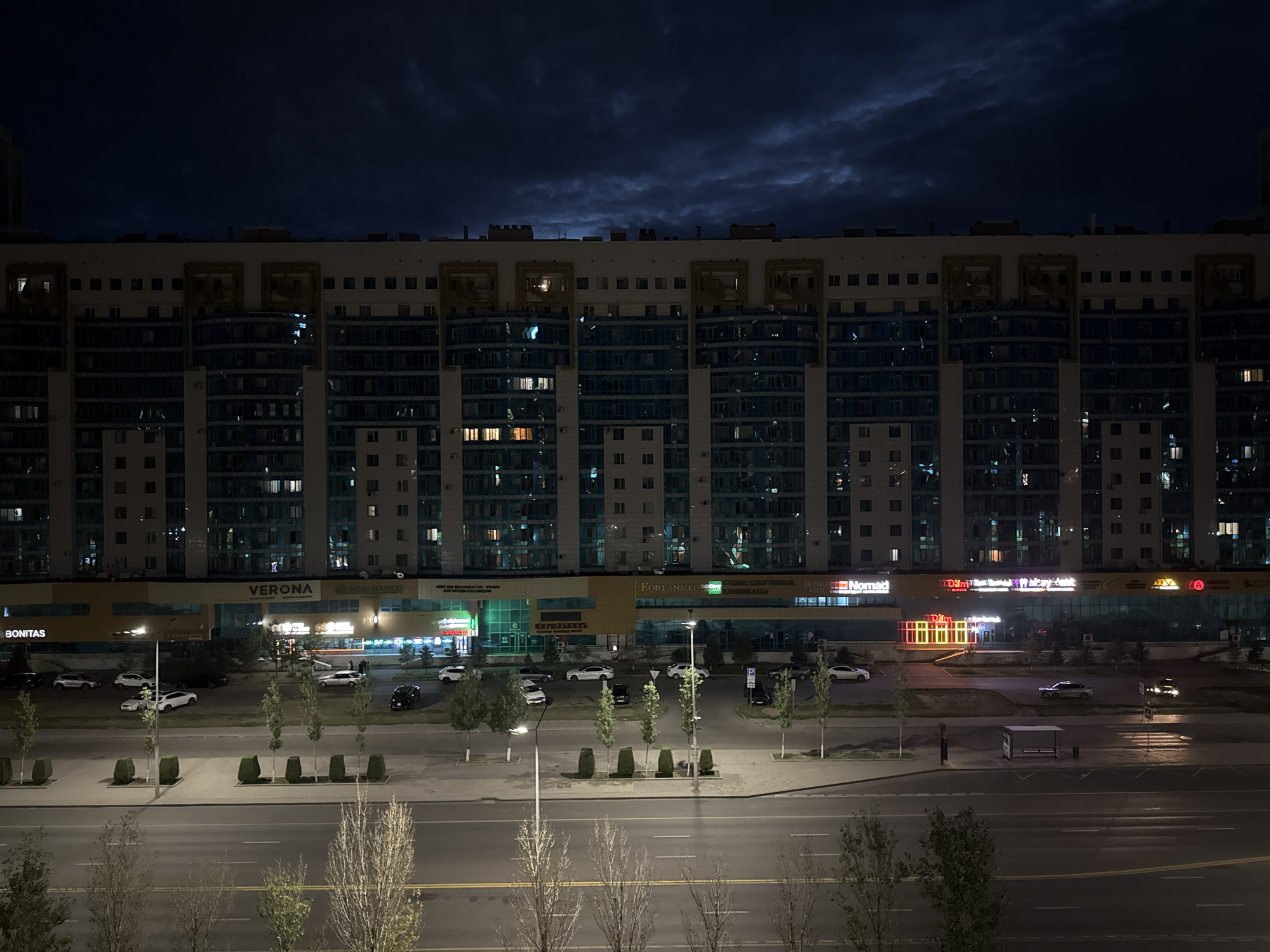 Nighttime residential streets and apartment buildings in Astana