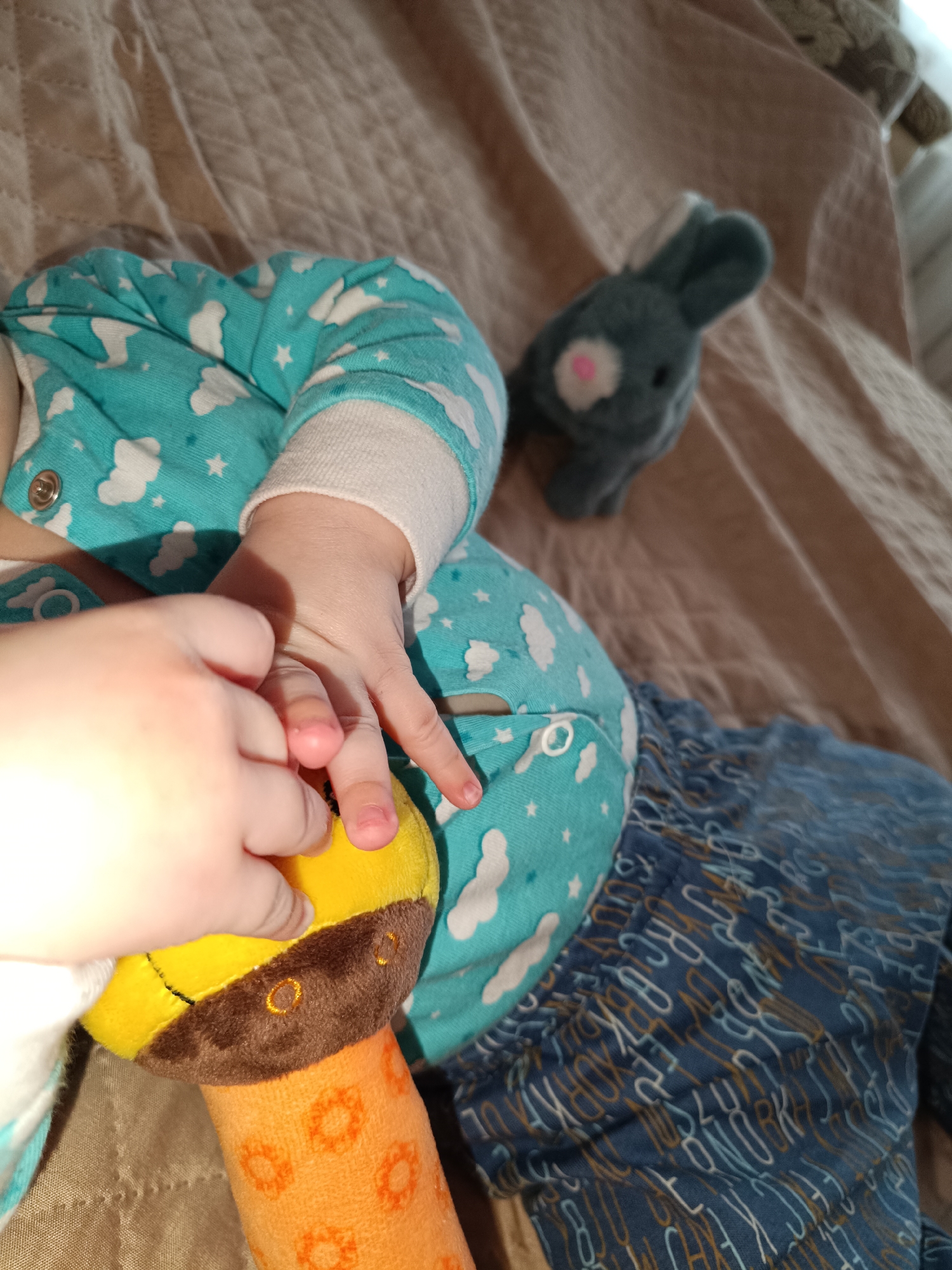 Baby's playtime with colorful toys captured in Tobolsk home