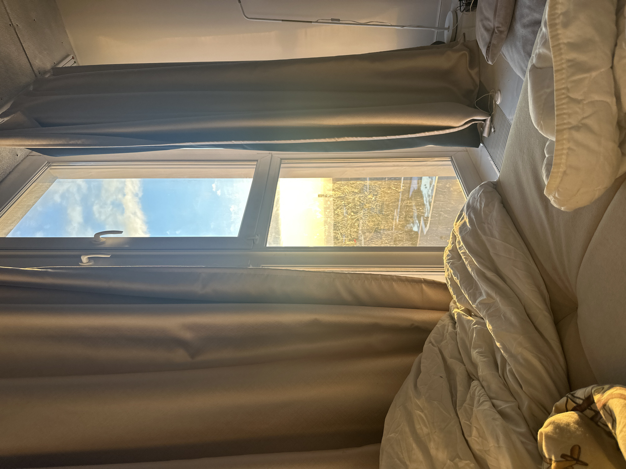 Moscow resident games in sunlit bedroom during afternoon hours