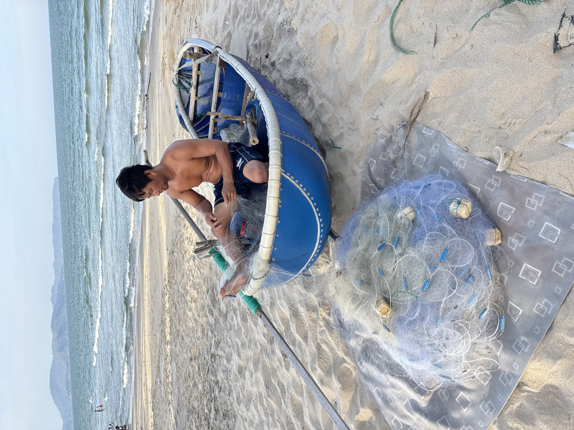 Morning beach life in South Quy Nhon — fishing, play, and shoreline details