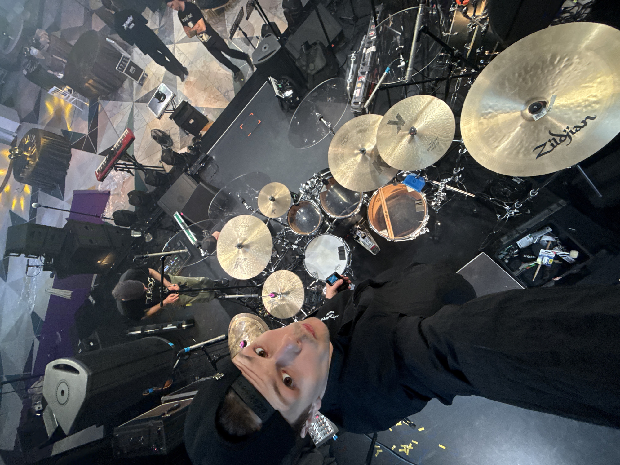 Drummer performs on Moscow stage, looks at cameras