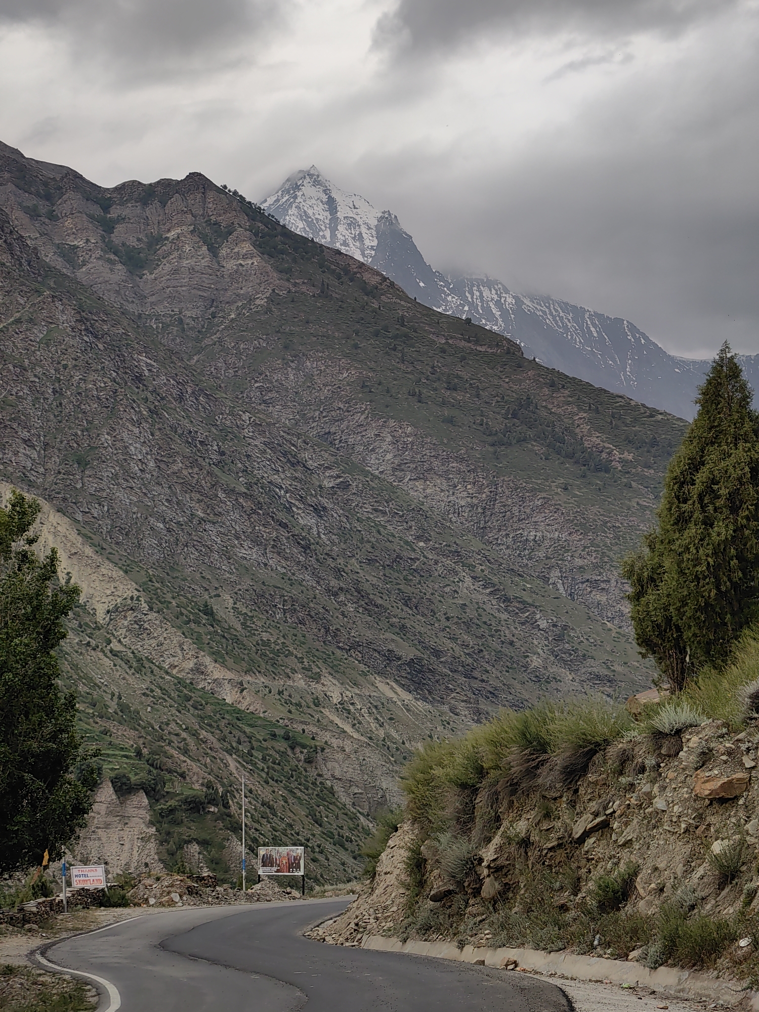 Kardang village and its mountain landscape under stormy skies