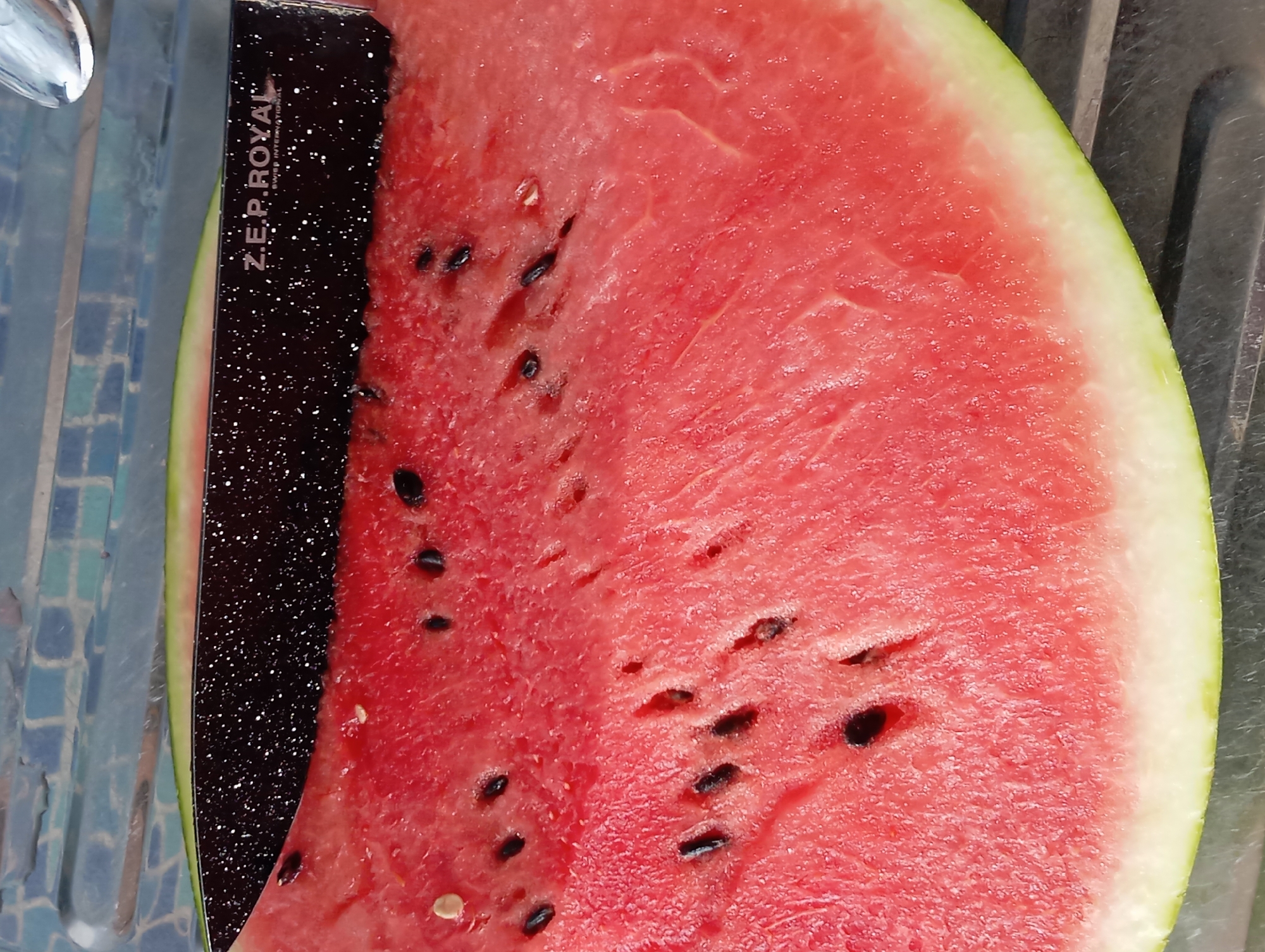 Fresh watermelon being sliced and served in Temryuk