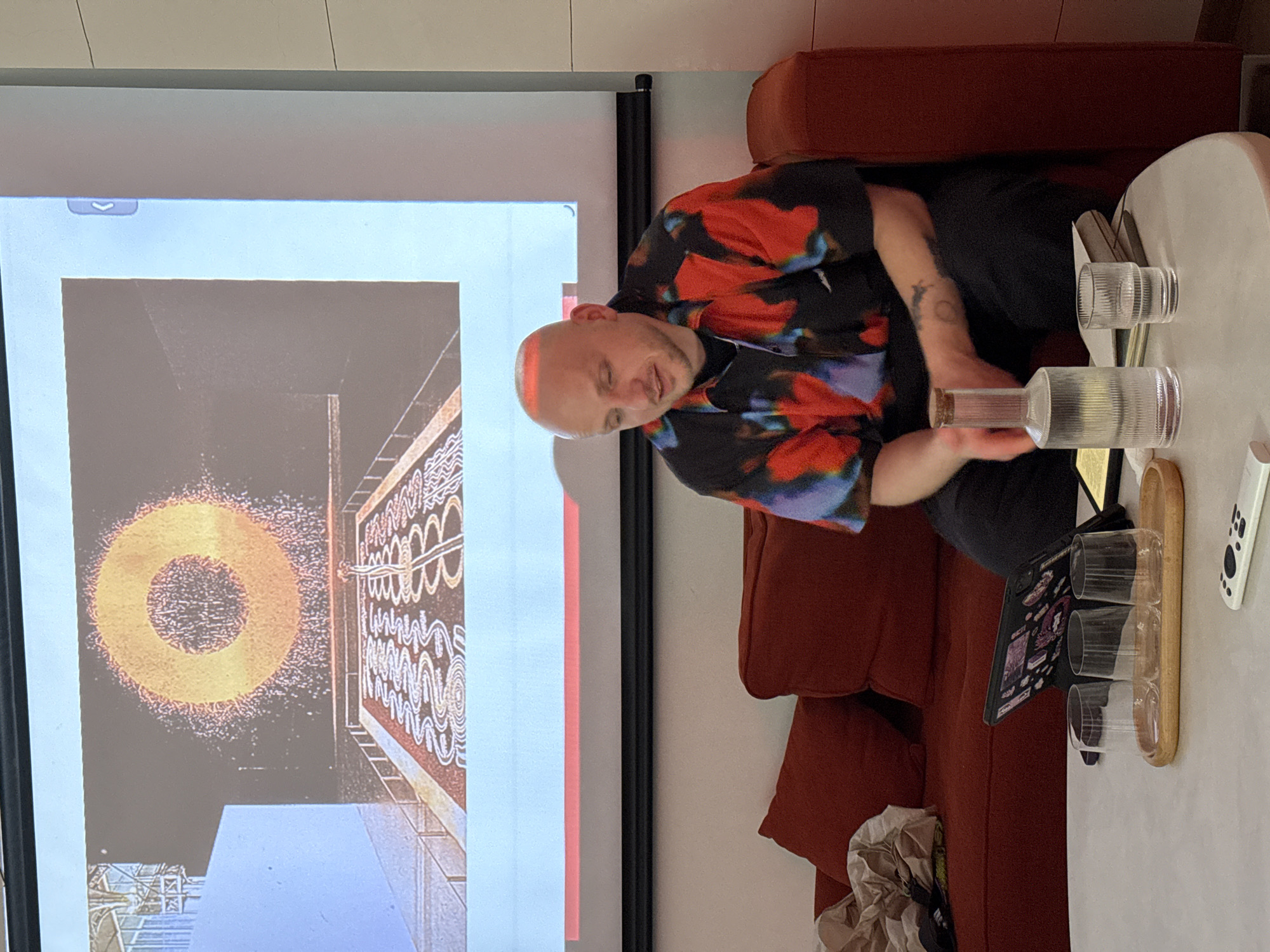 Man views abstract art on projection screen in Moscow