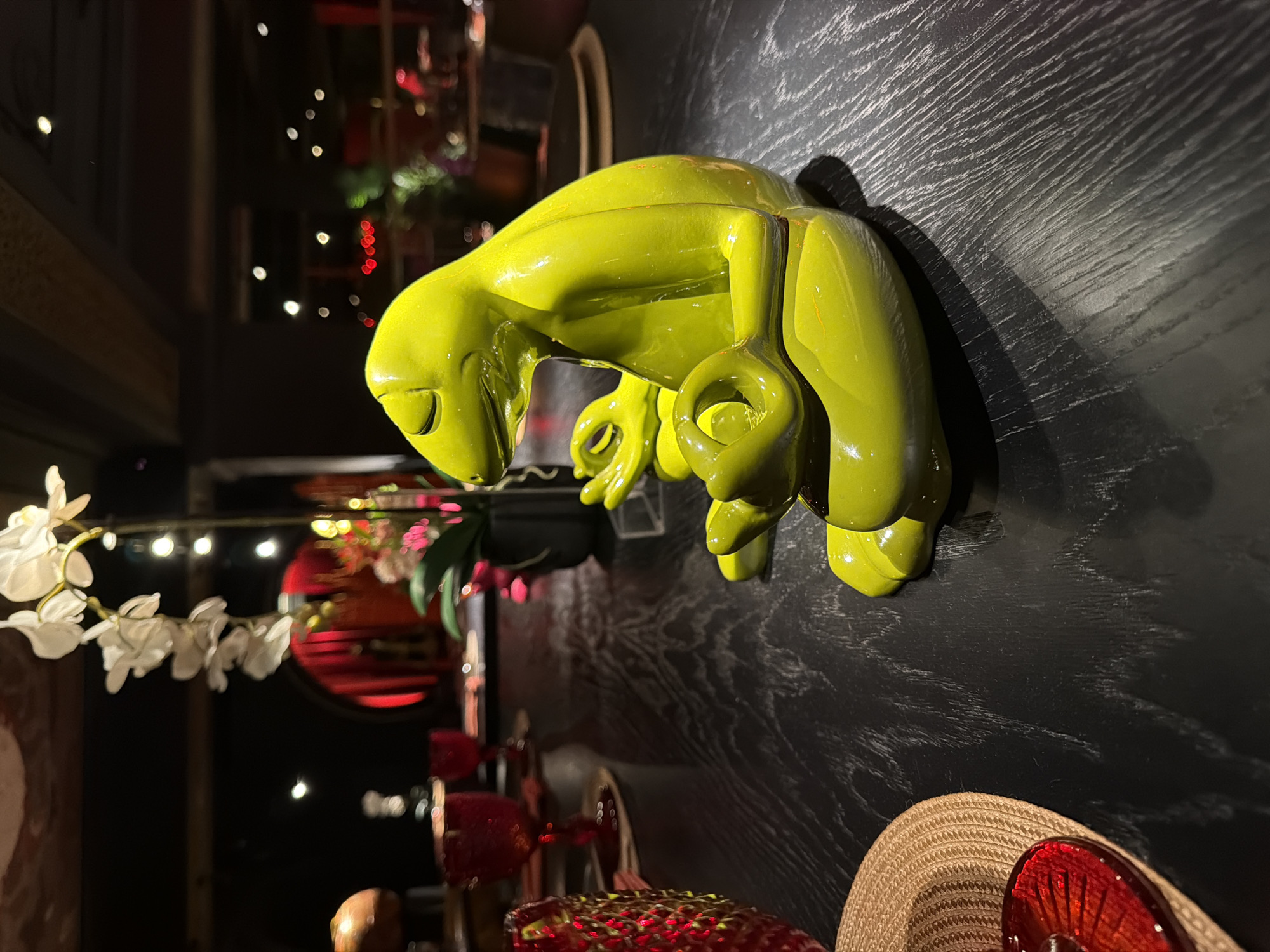 Moscow bar interior captured with decorative sculptures, patrons