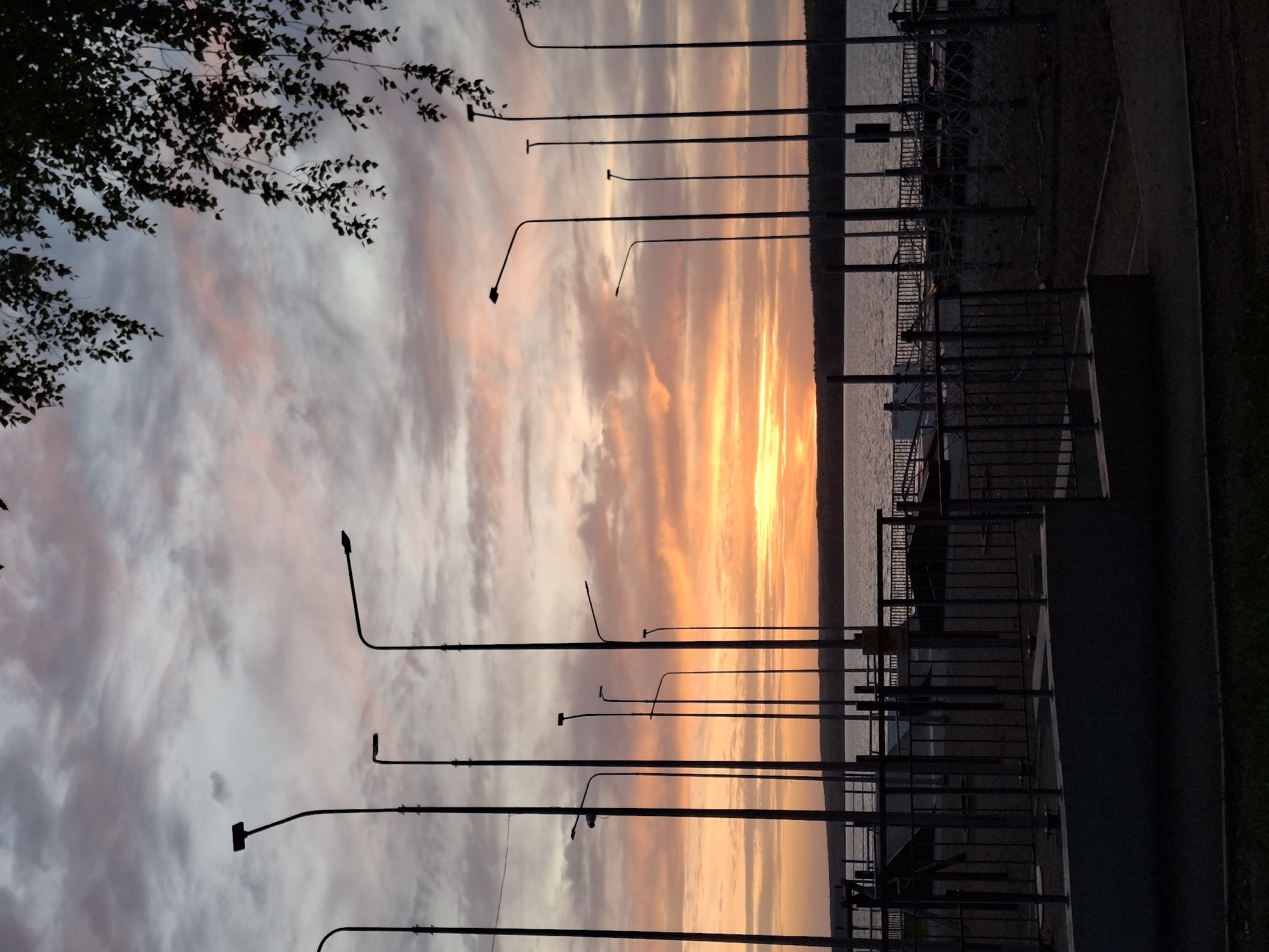 Sunset observed along Chaikovsky waterfront with colorful sky display