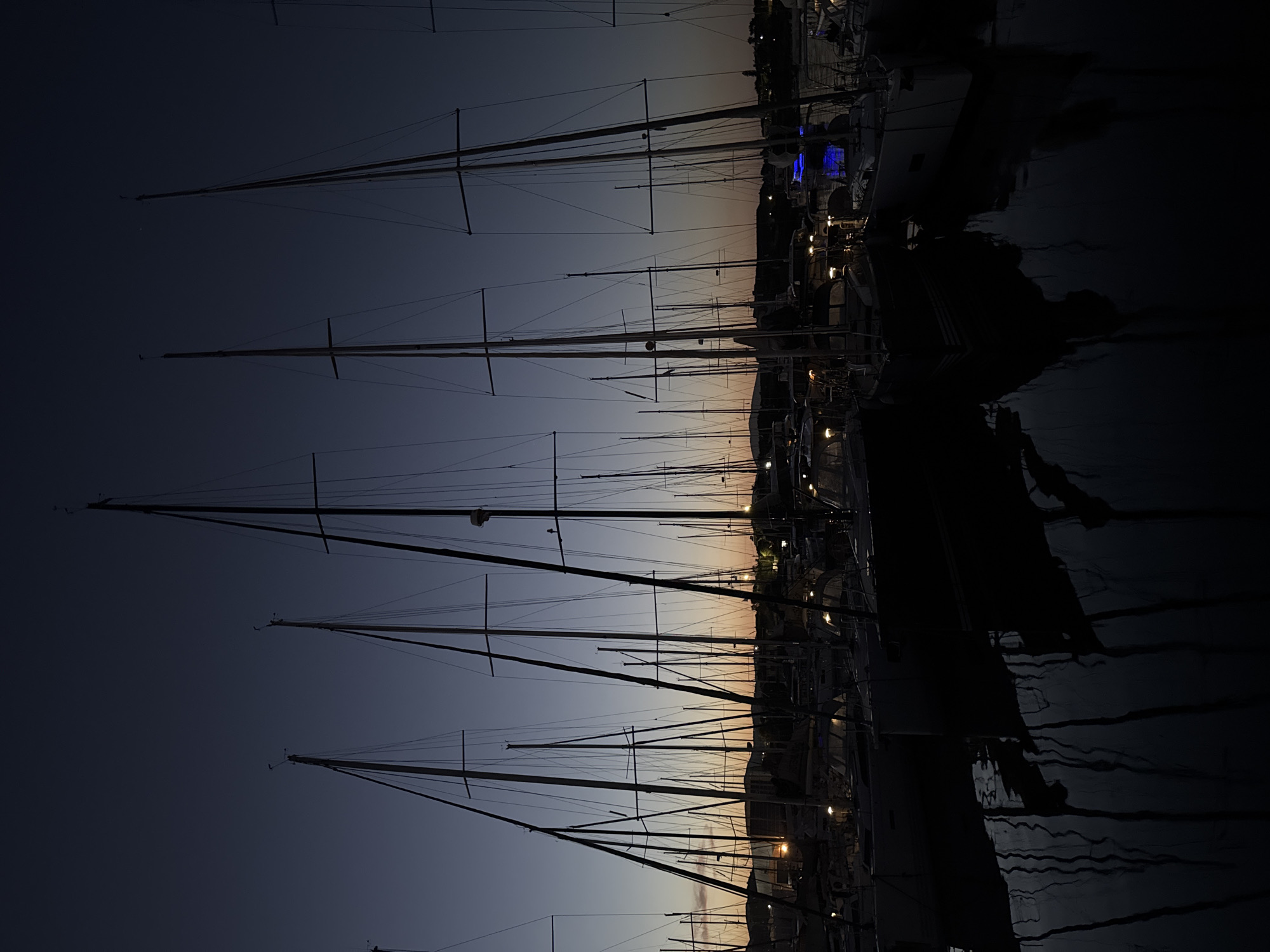 Evening marina gathering with dining aboard sailboat in Greece