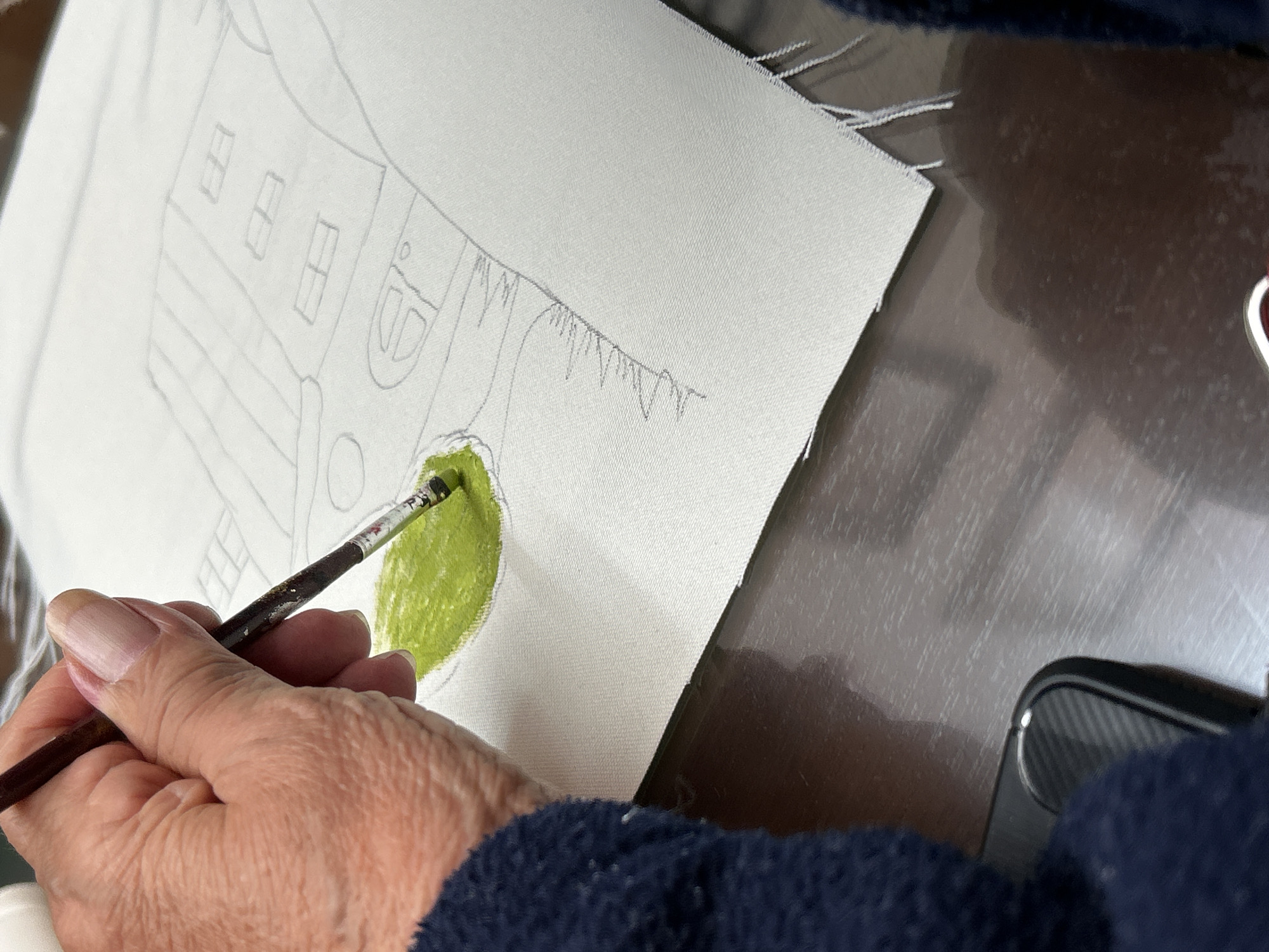 Artist creates landscape and floral paintings in outdoor session