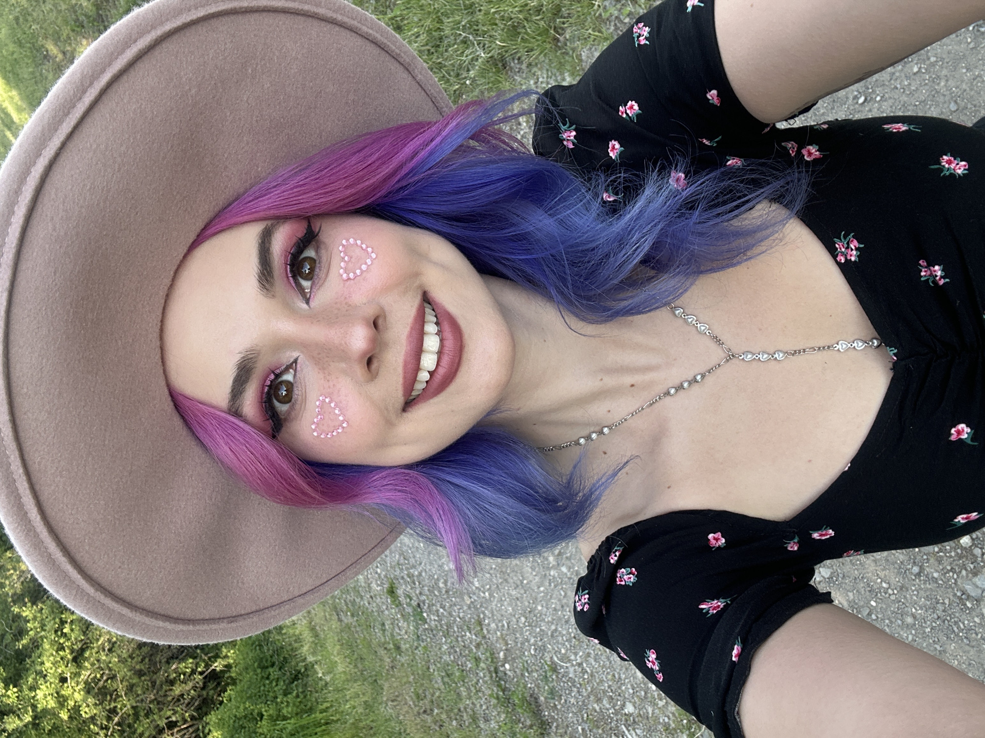 Woman takes cheerful selfies in Zagreb park on sunny afternoon