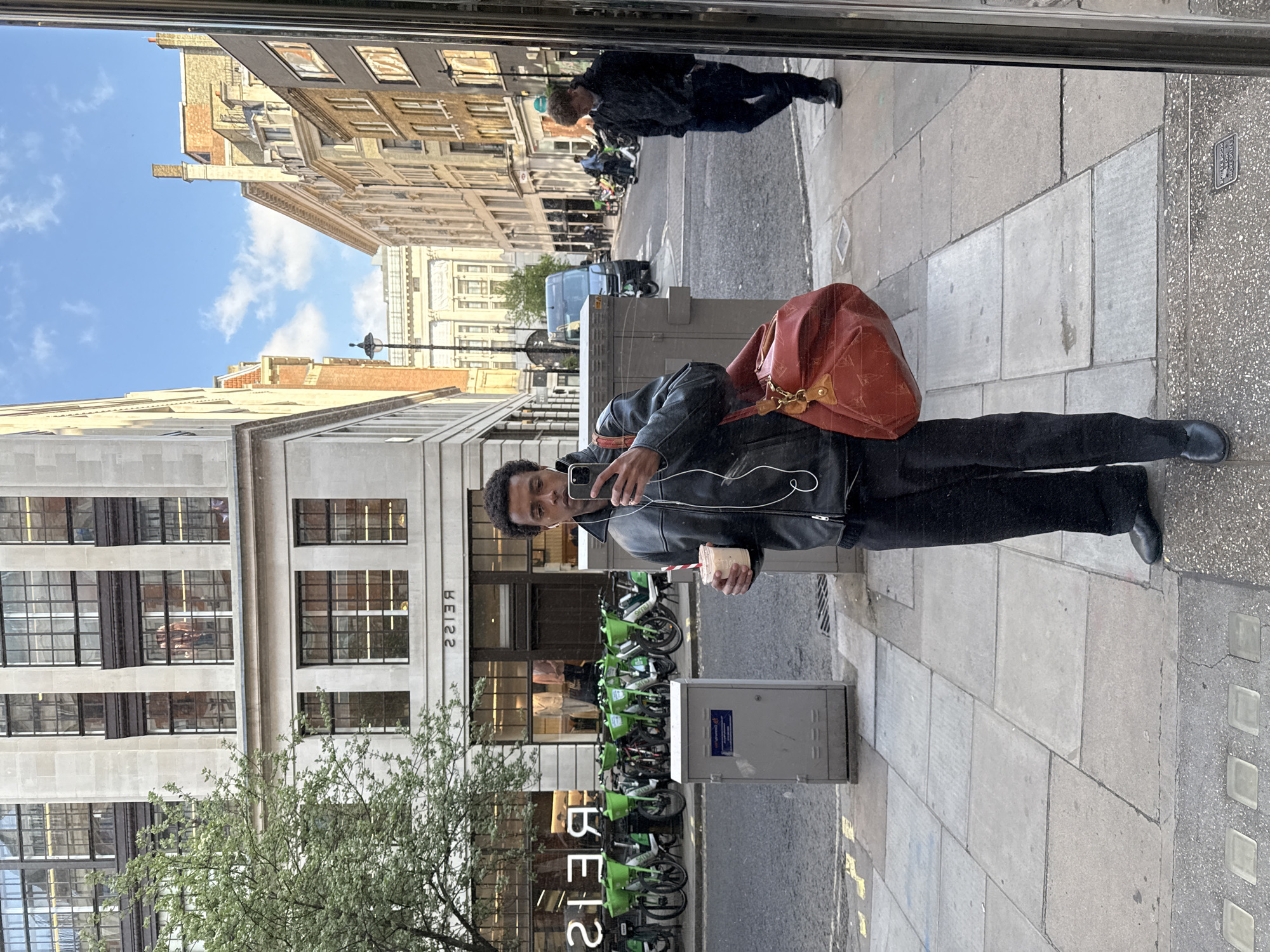 Man Takes Selfie in London Shop Window Reflection
