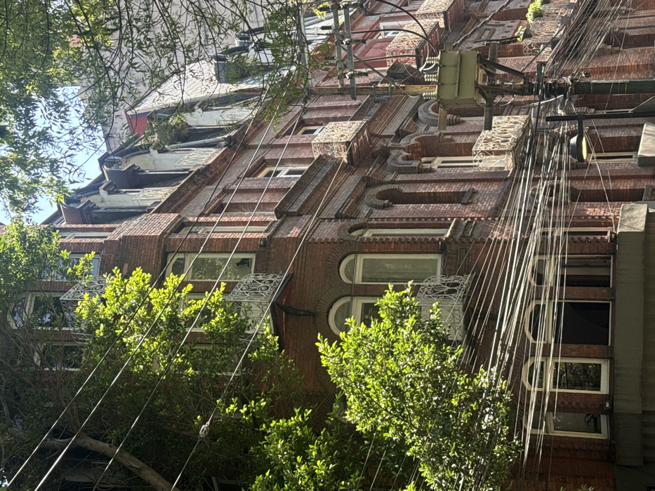 Workers maintain Mexico City infrastructure amid colonial architecture documentation