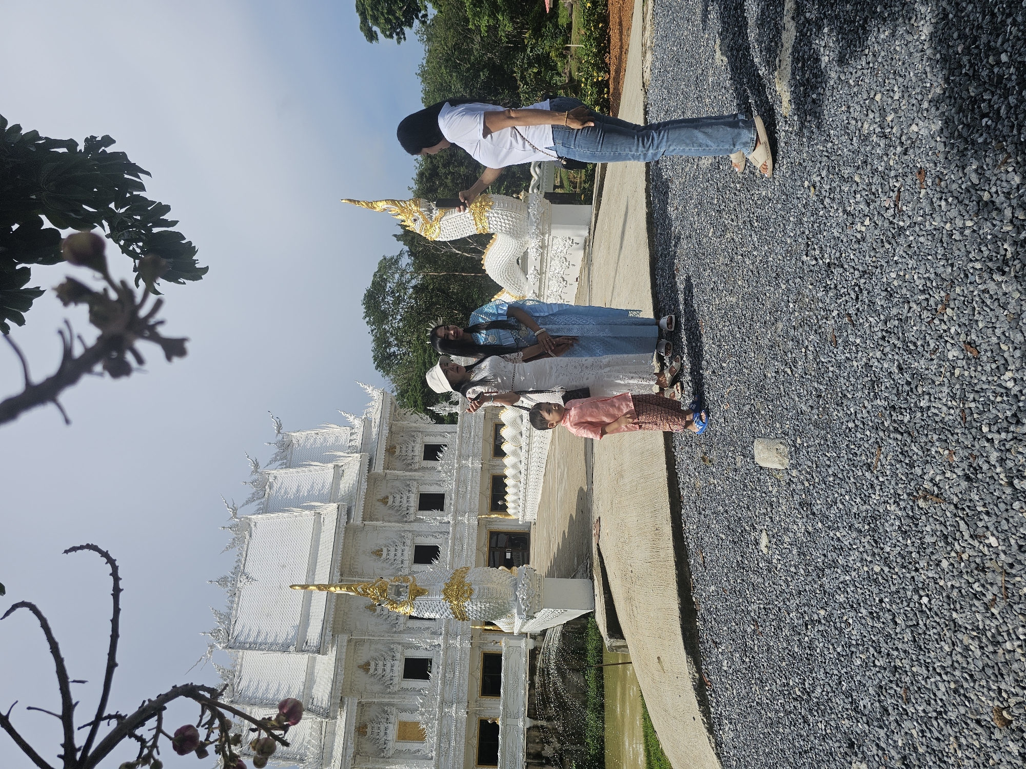 Group visit to Wat Rong Khun during a ceremonial occasion